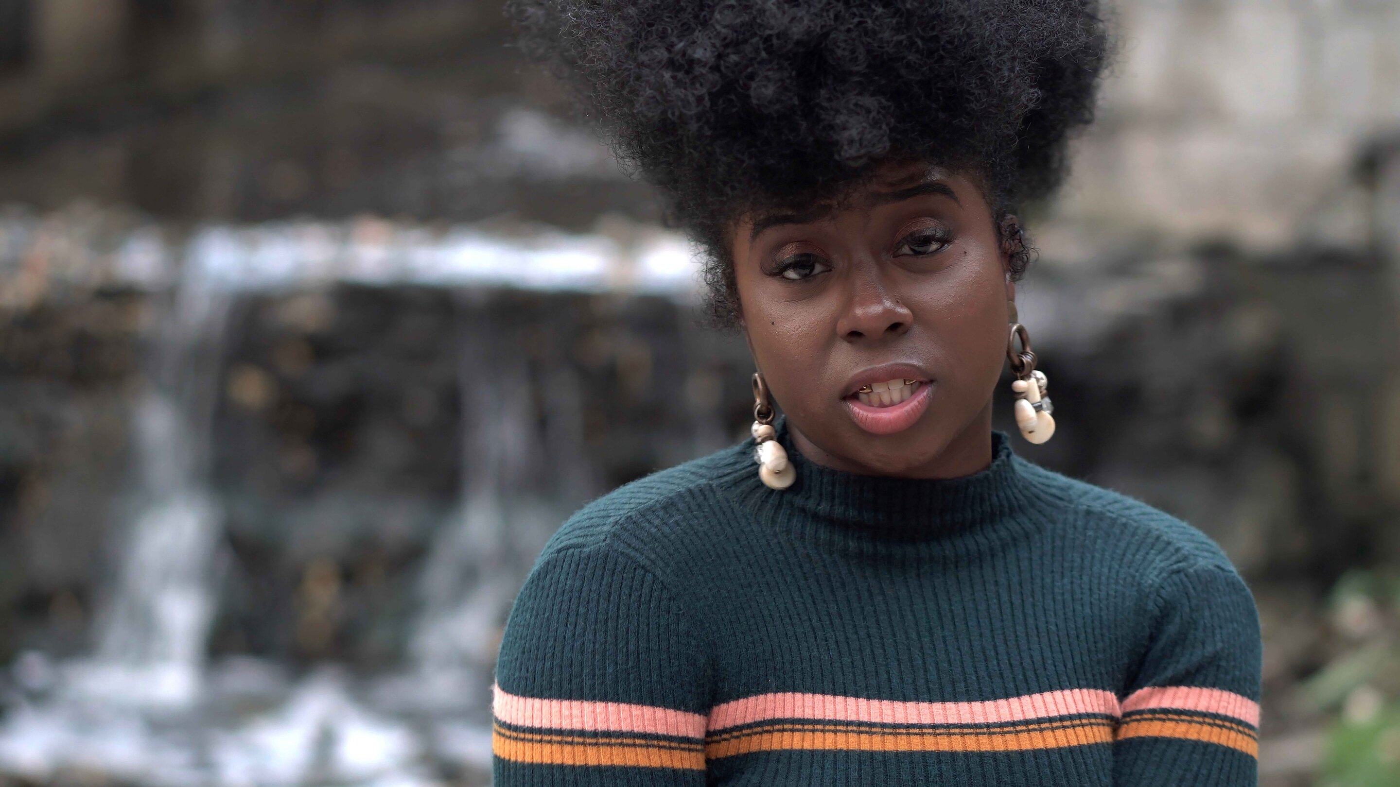 world afro day: woman with her hair in an afro fauxhawk style