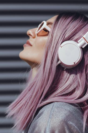 Woman with headphones light purple hair lilac hair long bob