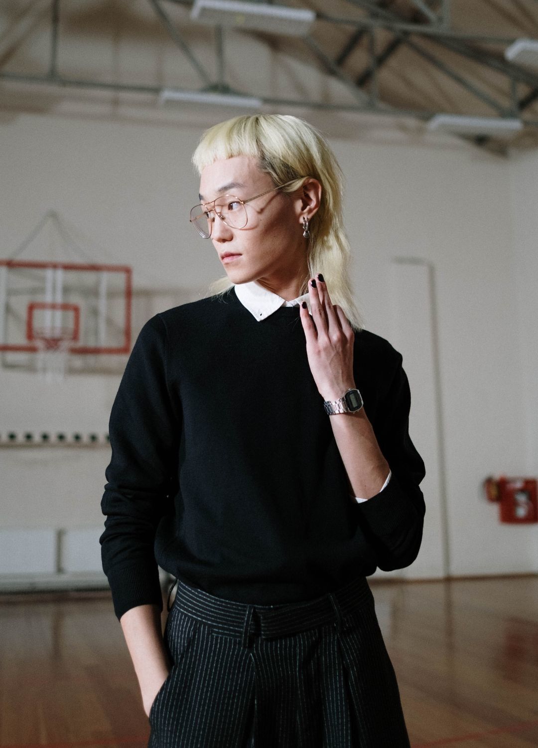 Kpop inspired hairstyle: man with straight blonde hair styled in a short mullet