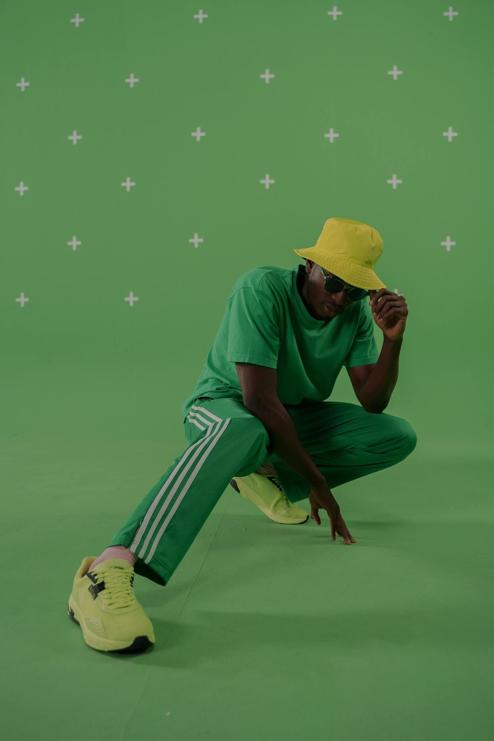 man wearing a bright yellow bucket hat