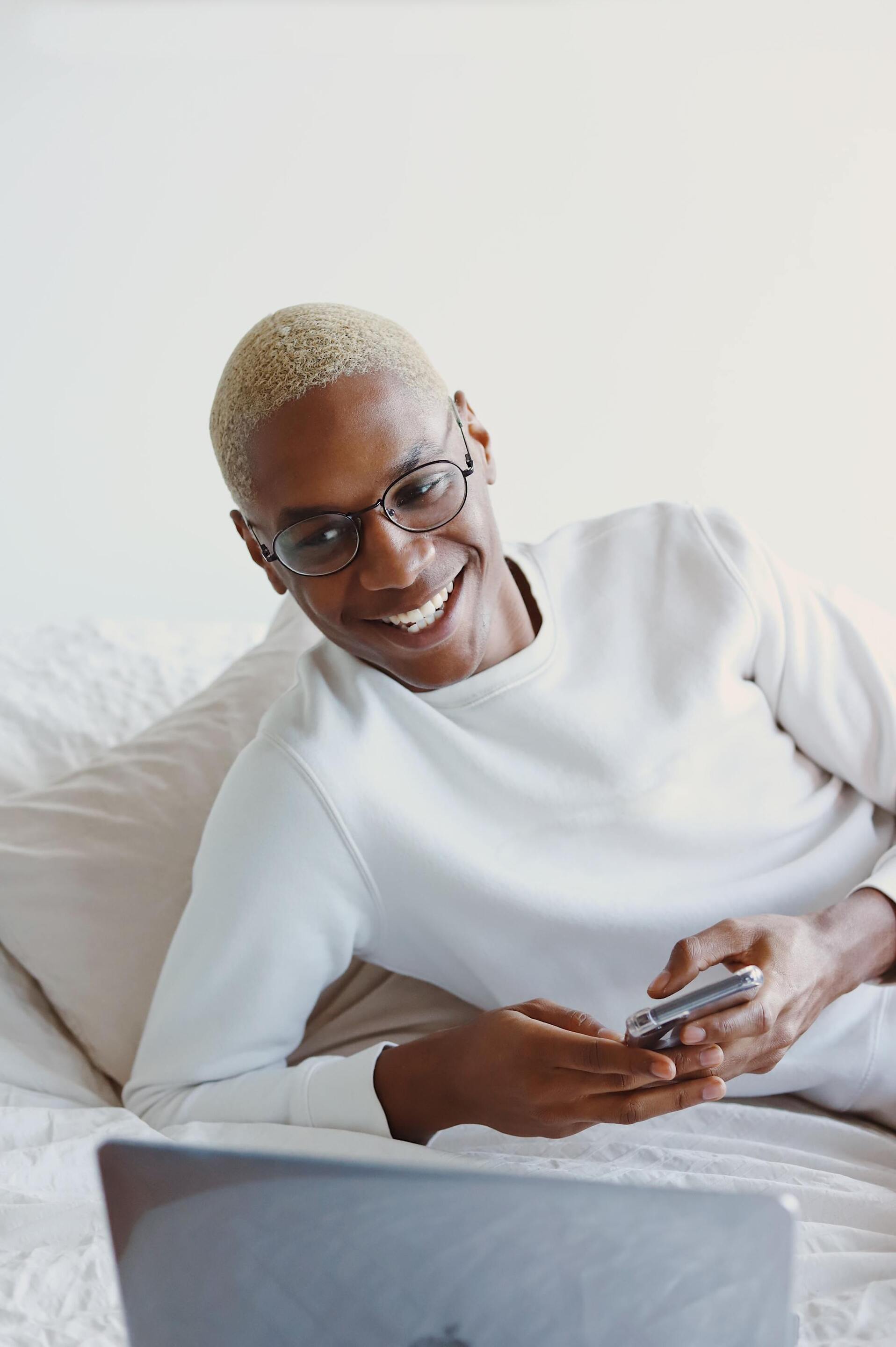 man with very short bleach blonde hair