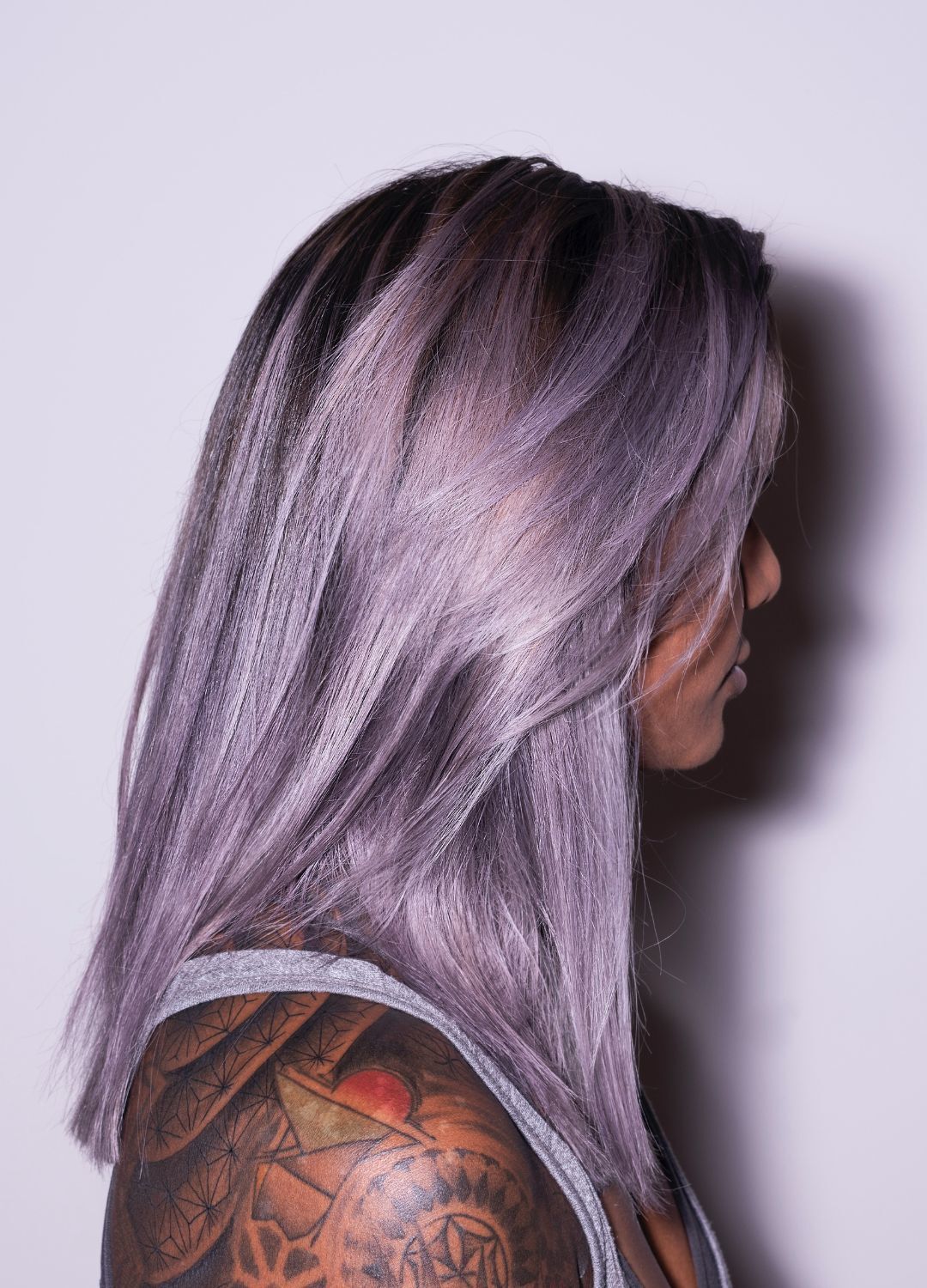 Kpop inspired hairstyle: woman with medium-length, straight pastel purple / lavender-coloured hair