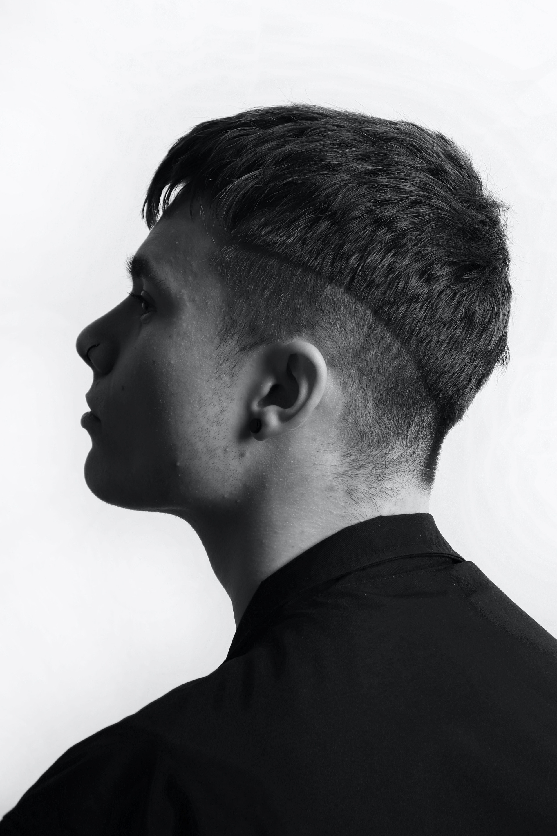 edgy male's haircut, tapered back