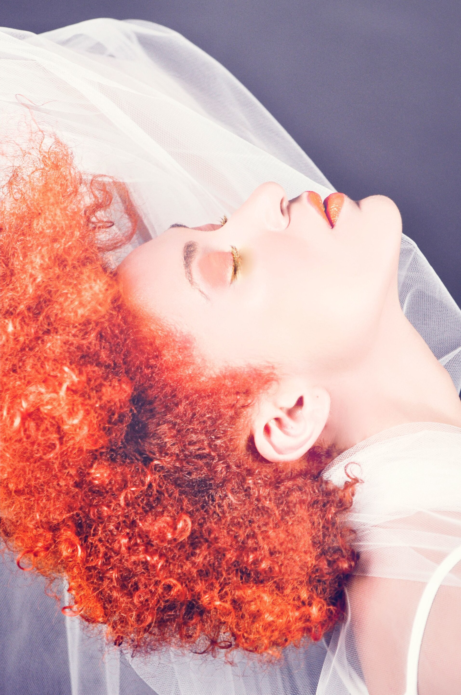 woman with a bright red afro