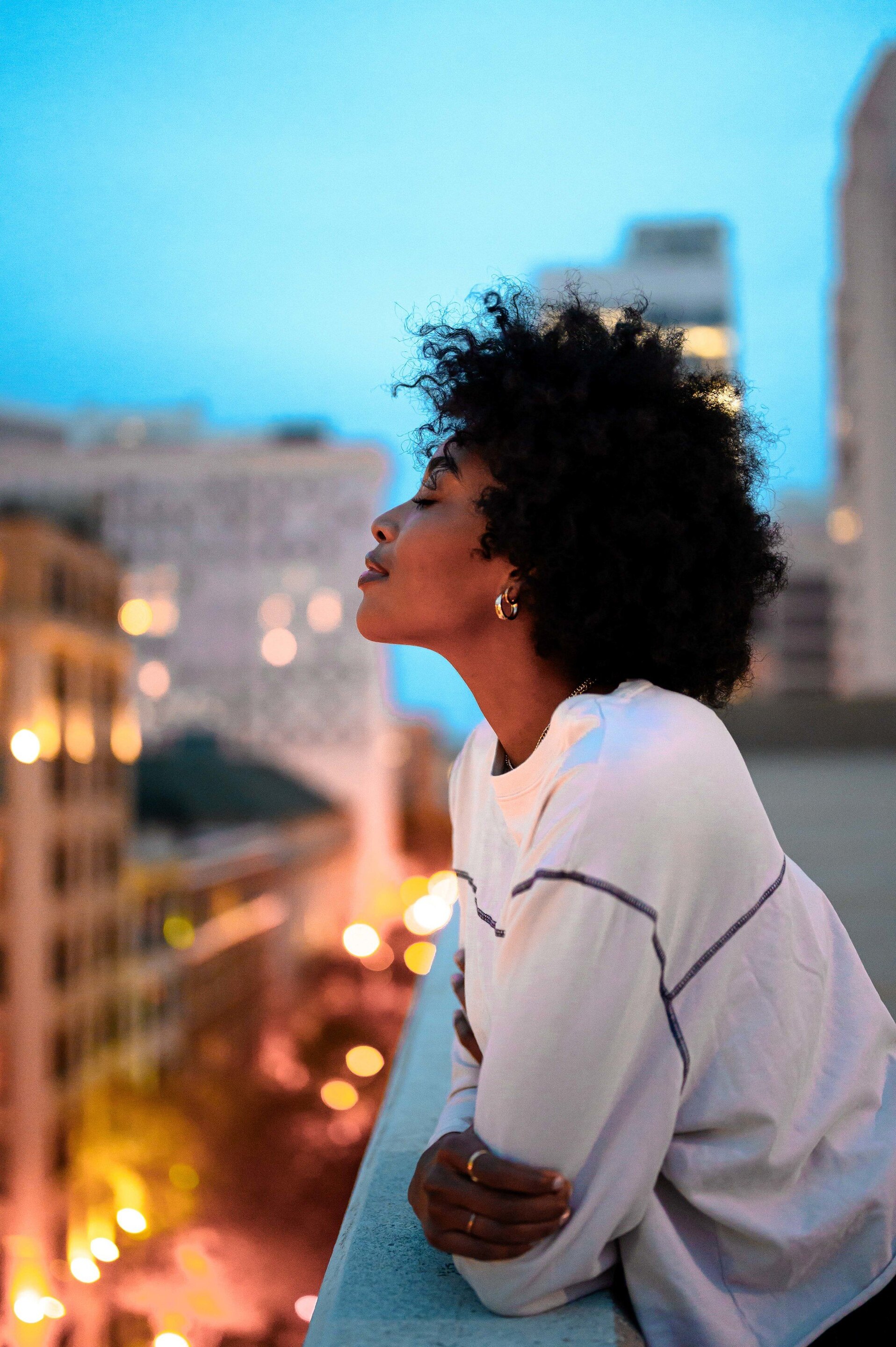 woman with a curly and coily hair afro hairstyle