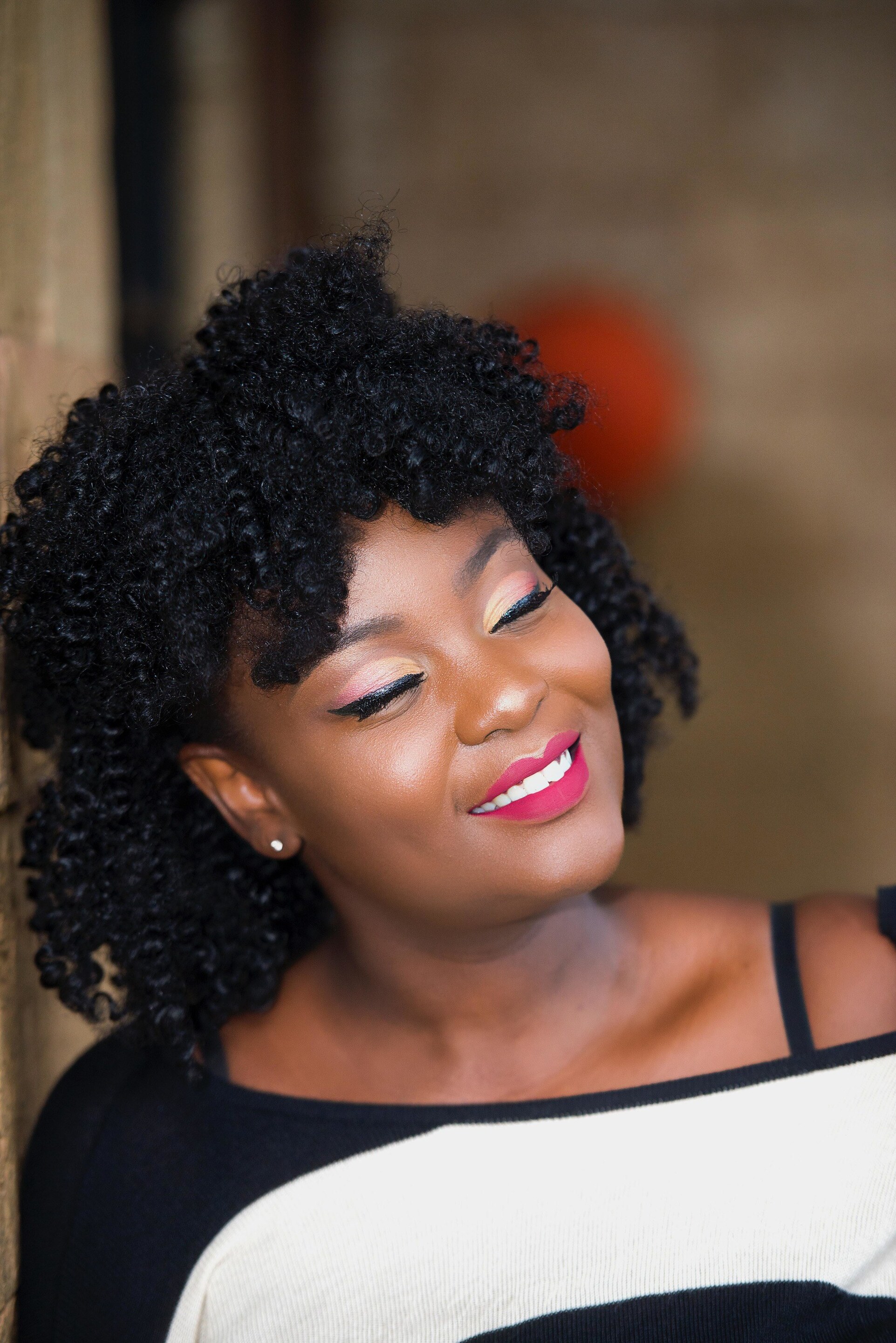 woman with dark curly and coily hair twist out hairstyle