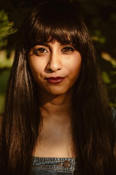 woman with long brown hair and a fringe