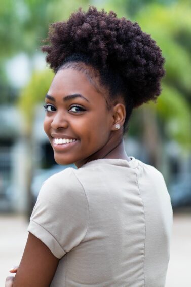 green tea shampoo: woman with beautiful Type 4C natural hair held back with a headband