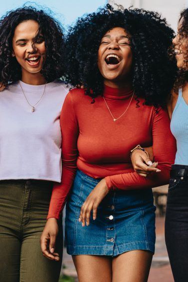 Group of curly haired women with Autumn hair colours