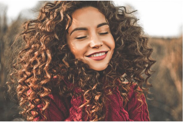 Woman with big, bouncy natural curls