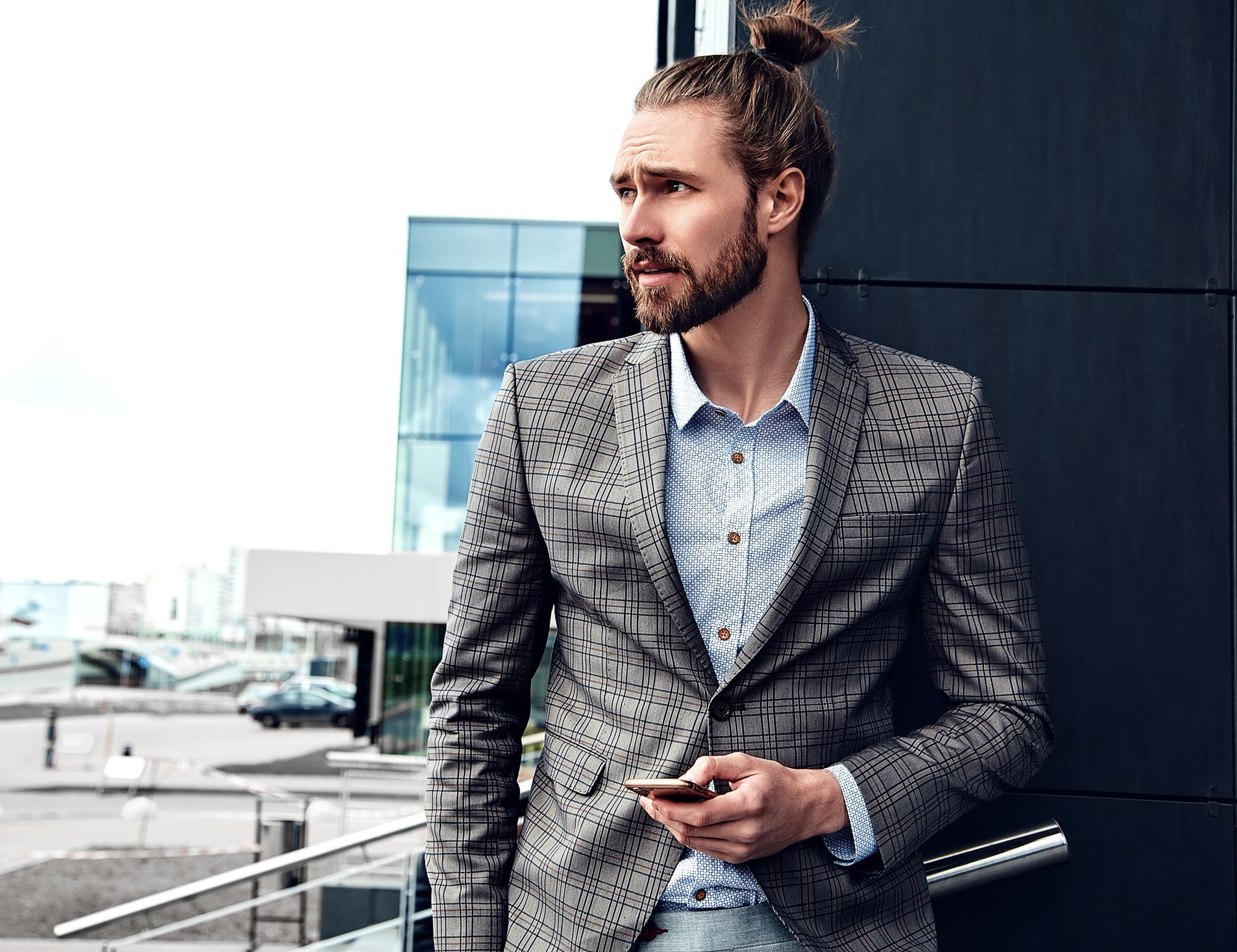 man in suit with neat man bun