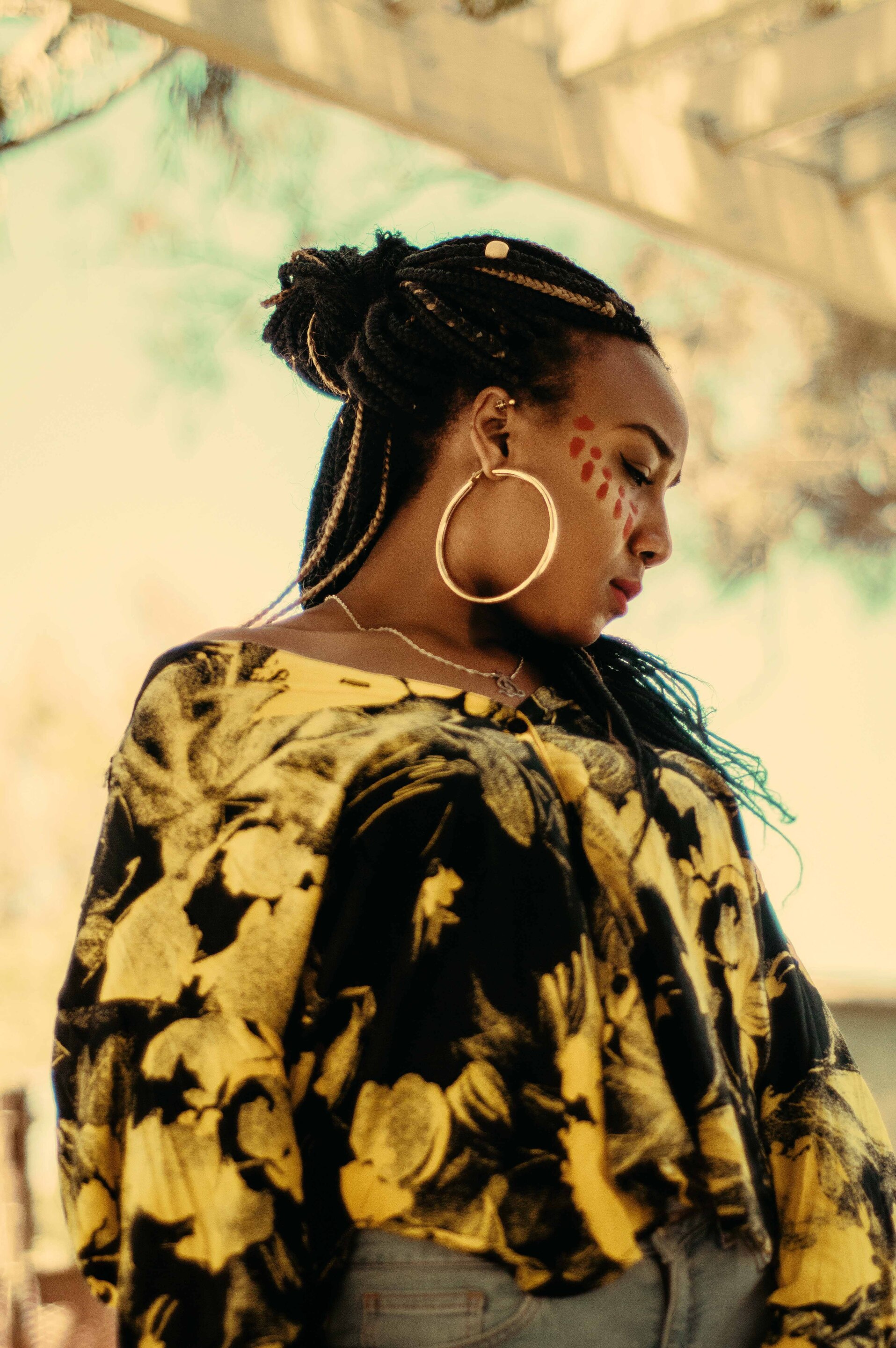black woman black blonde box braids half updo