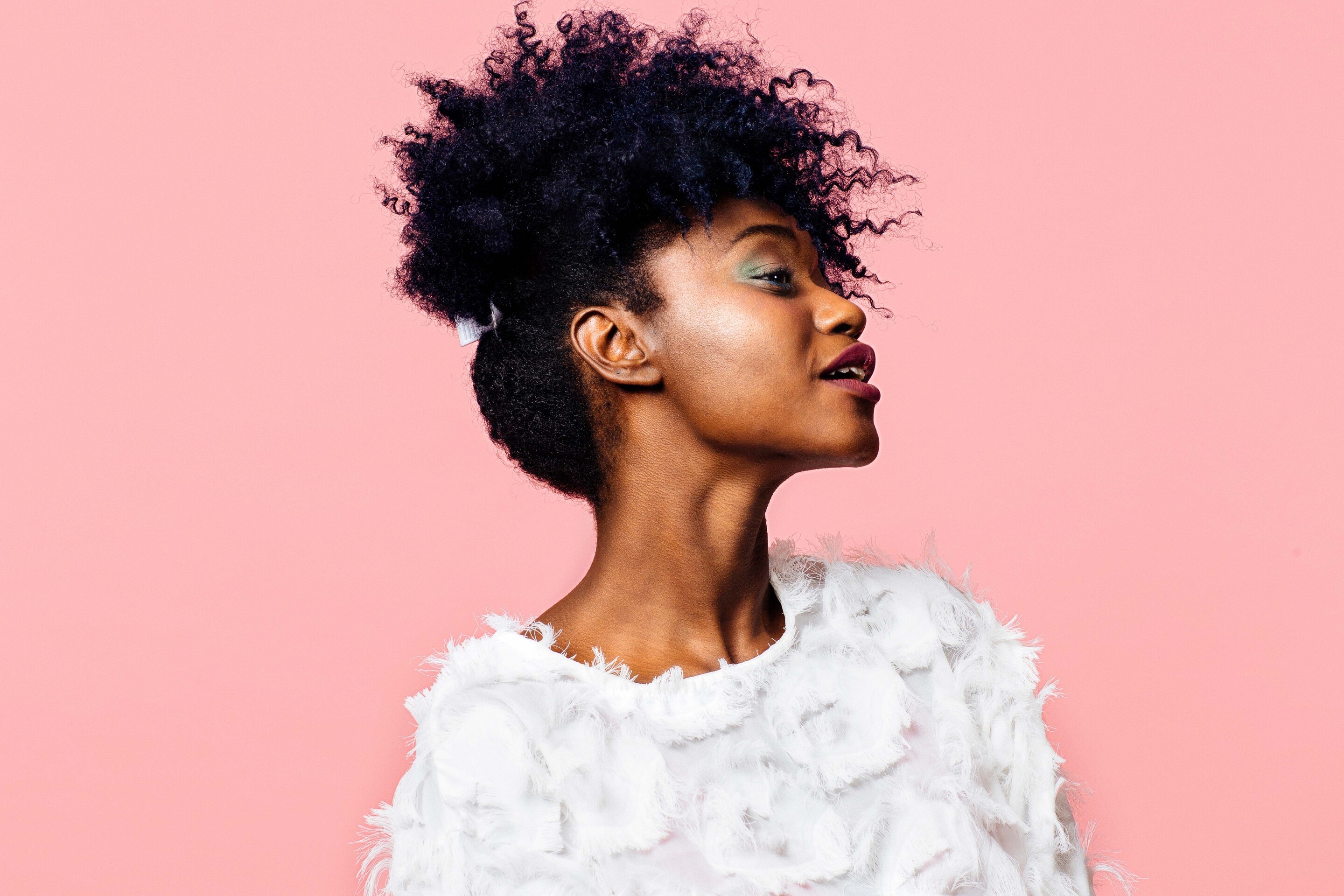 young woman afro hair updo accessory curls natural hair matric ball hairstyles