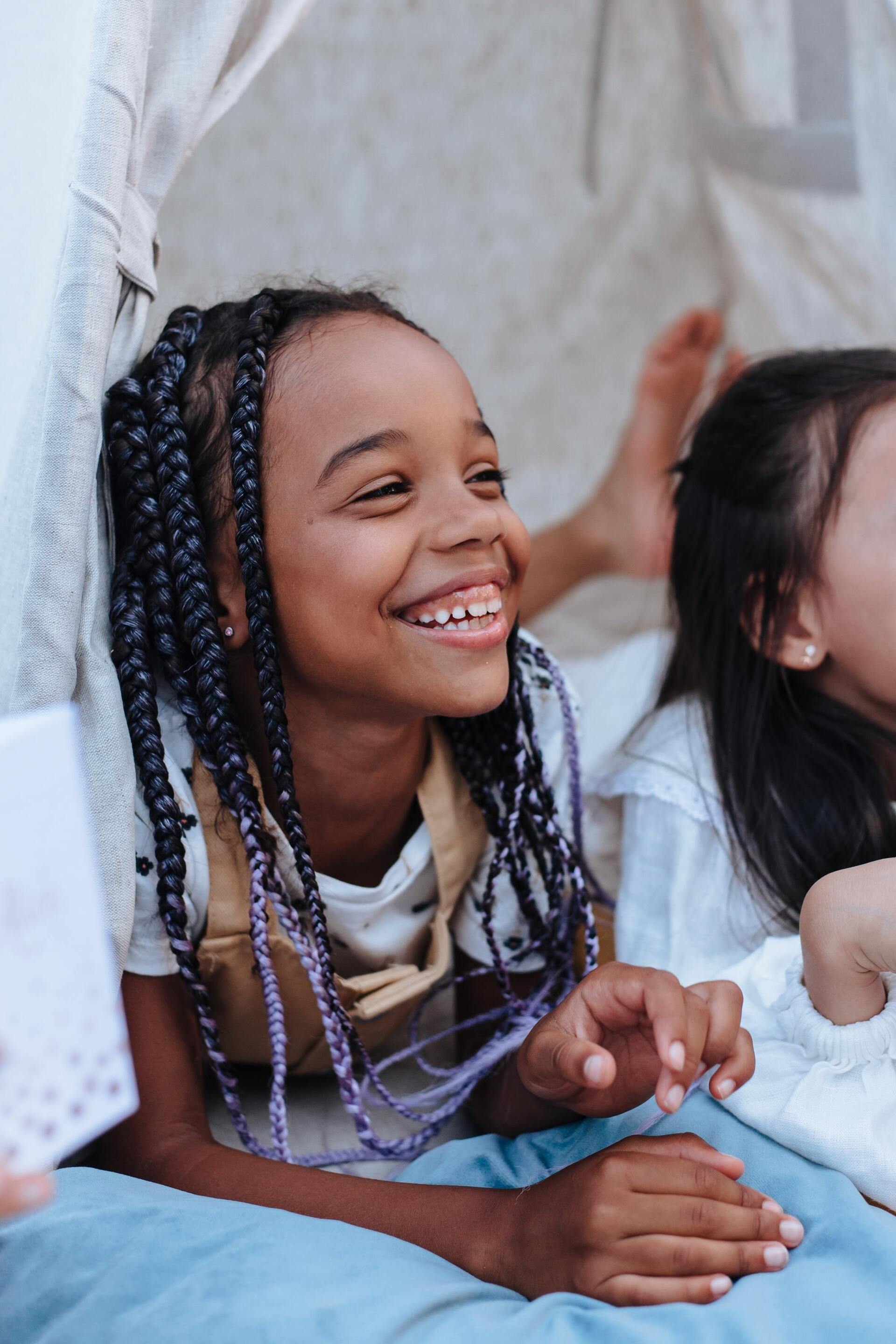 Little girl with colourful braids