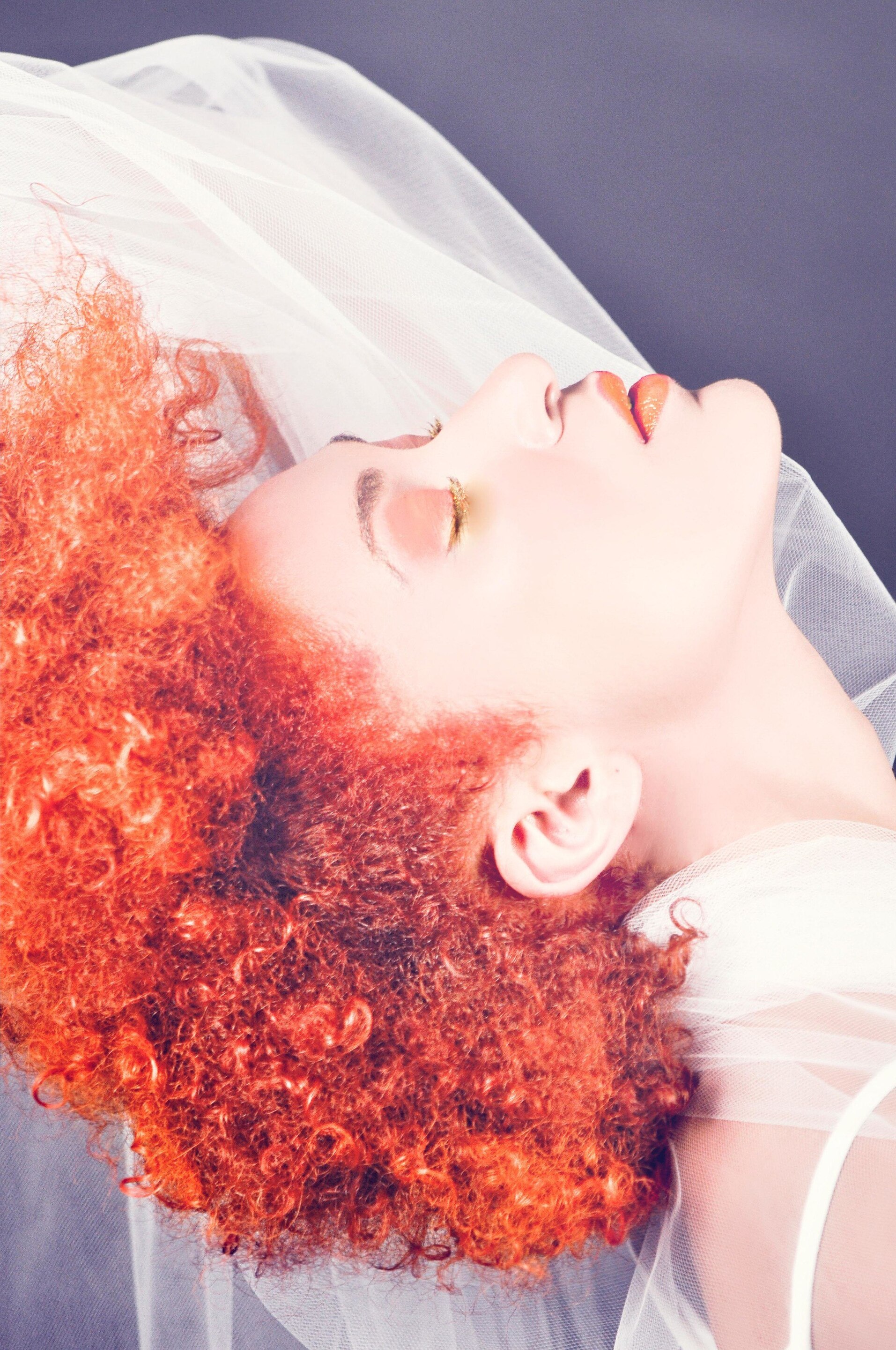summer hair colour: woman with bright red natural hair