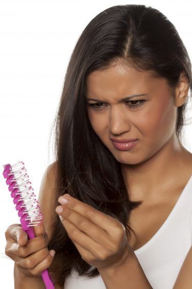 woman with a comb and excess hair