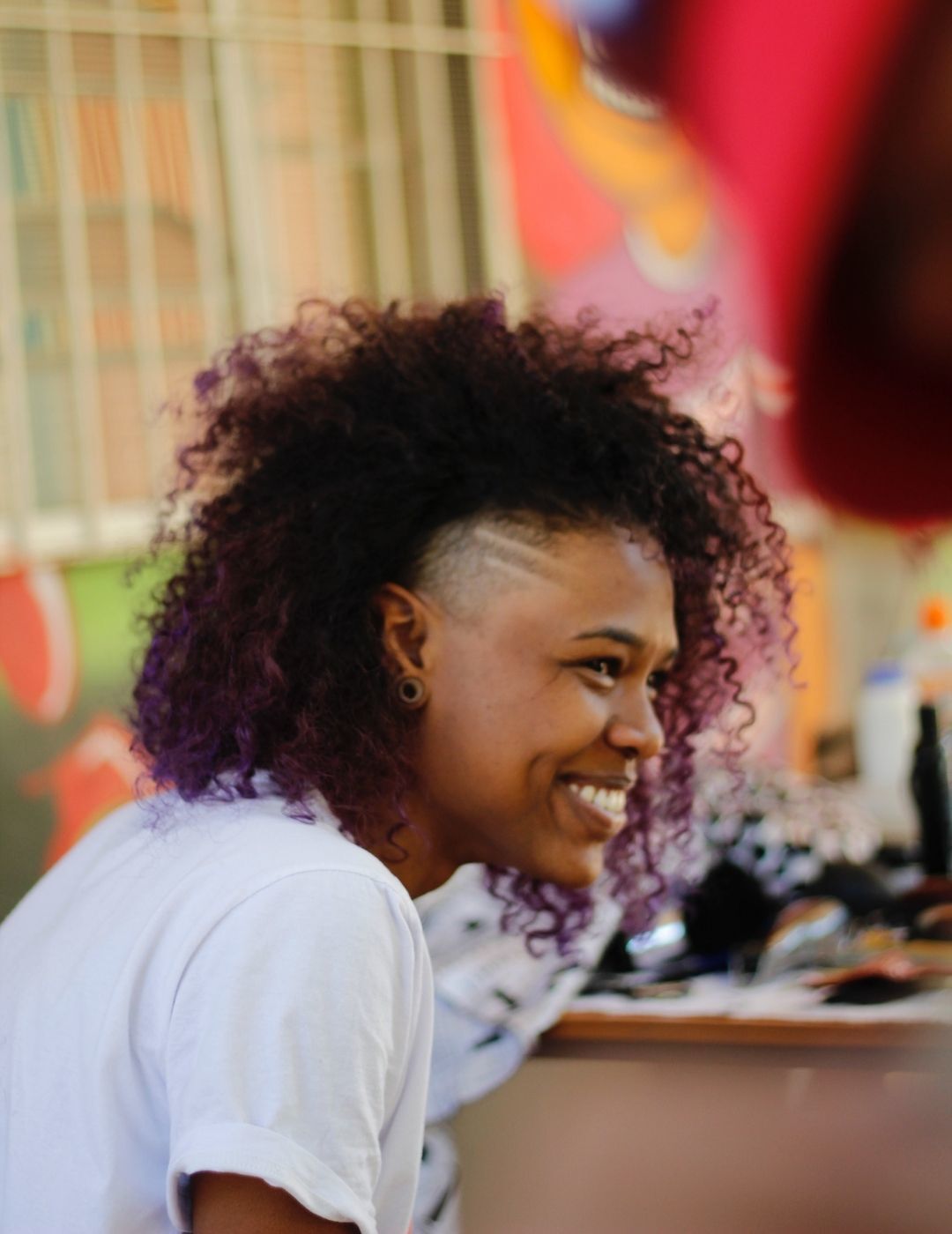 woman with curly hair and undercut