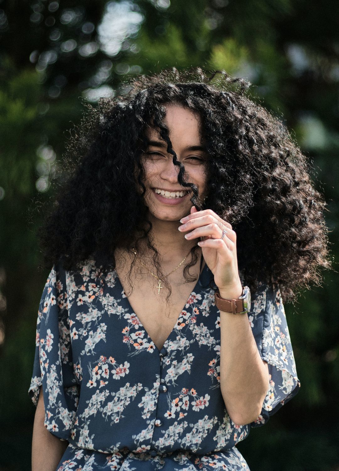 woman with long dark curly