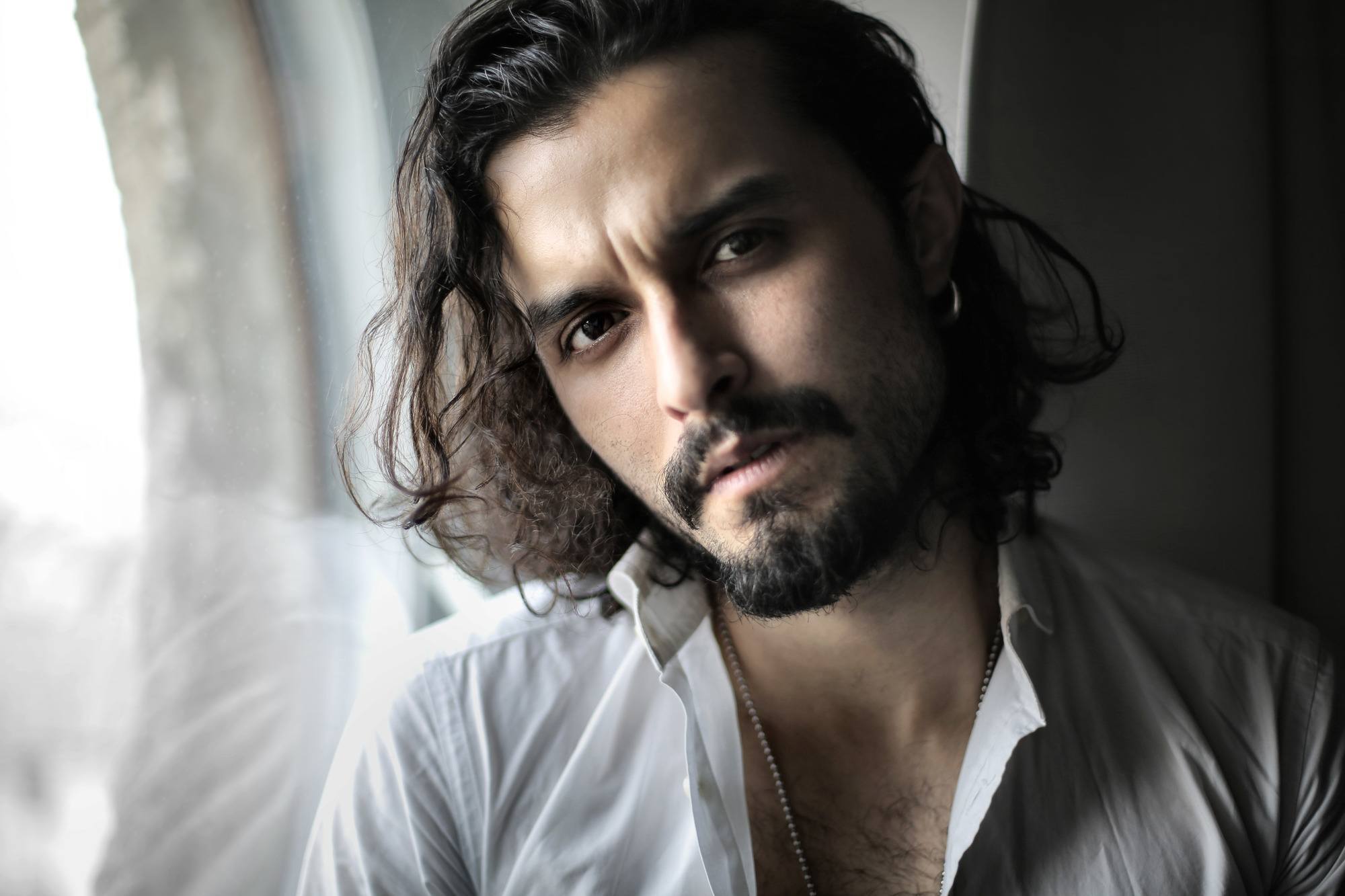 man with medium length wavy hair