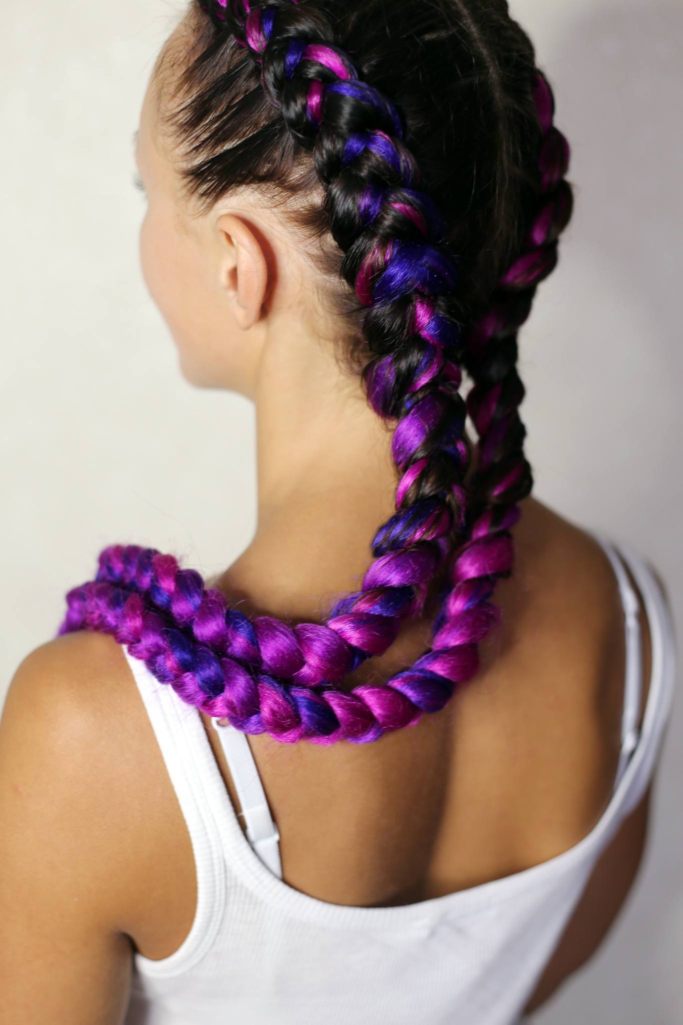 woman with blue and purple coloured boxer braids double dutch braids