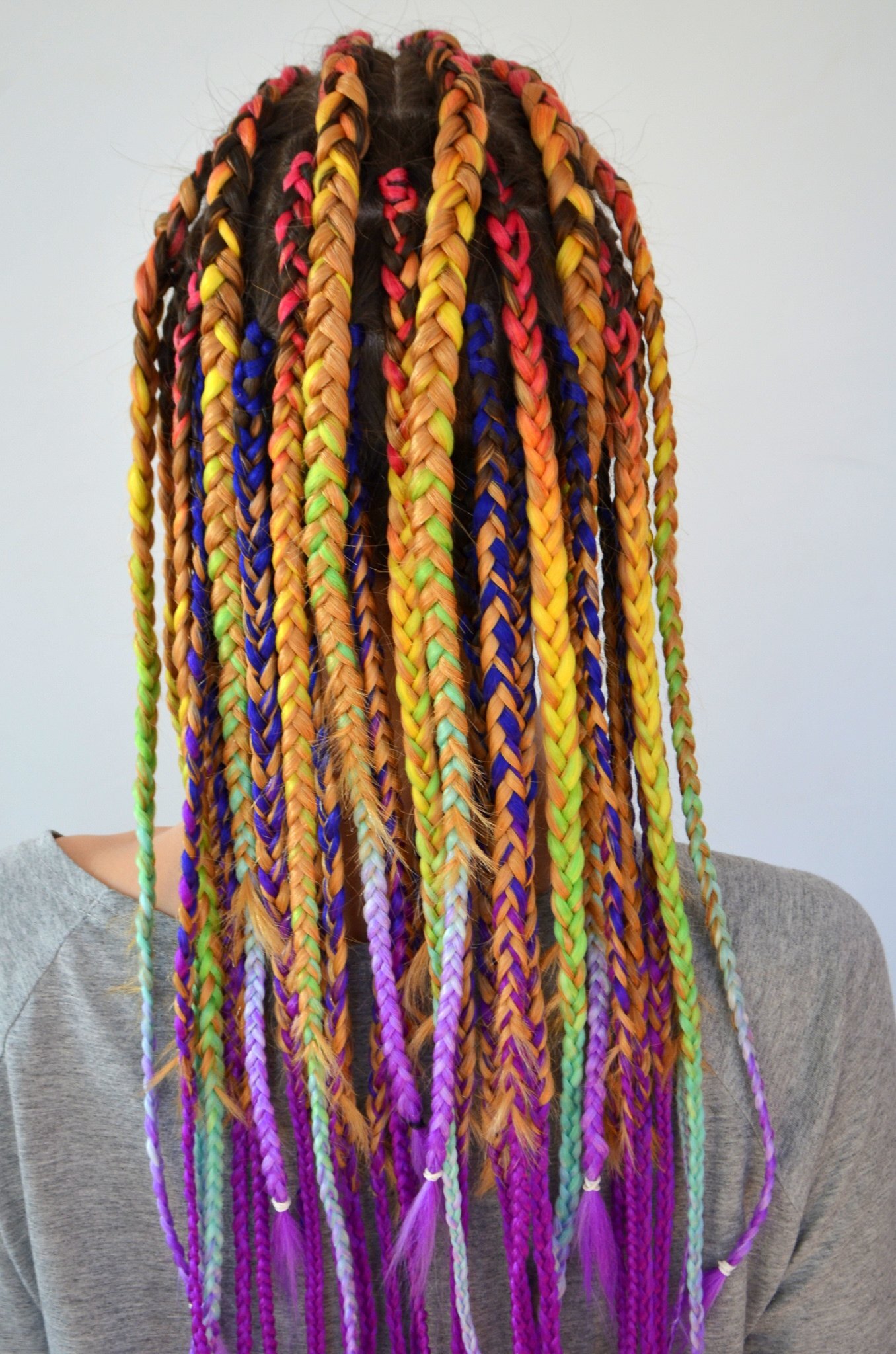 multicoloured coloured braids box braids orange yellow green purple braids