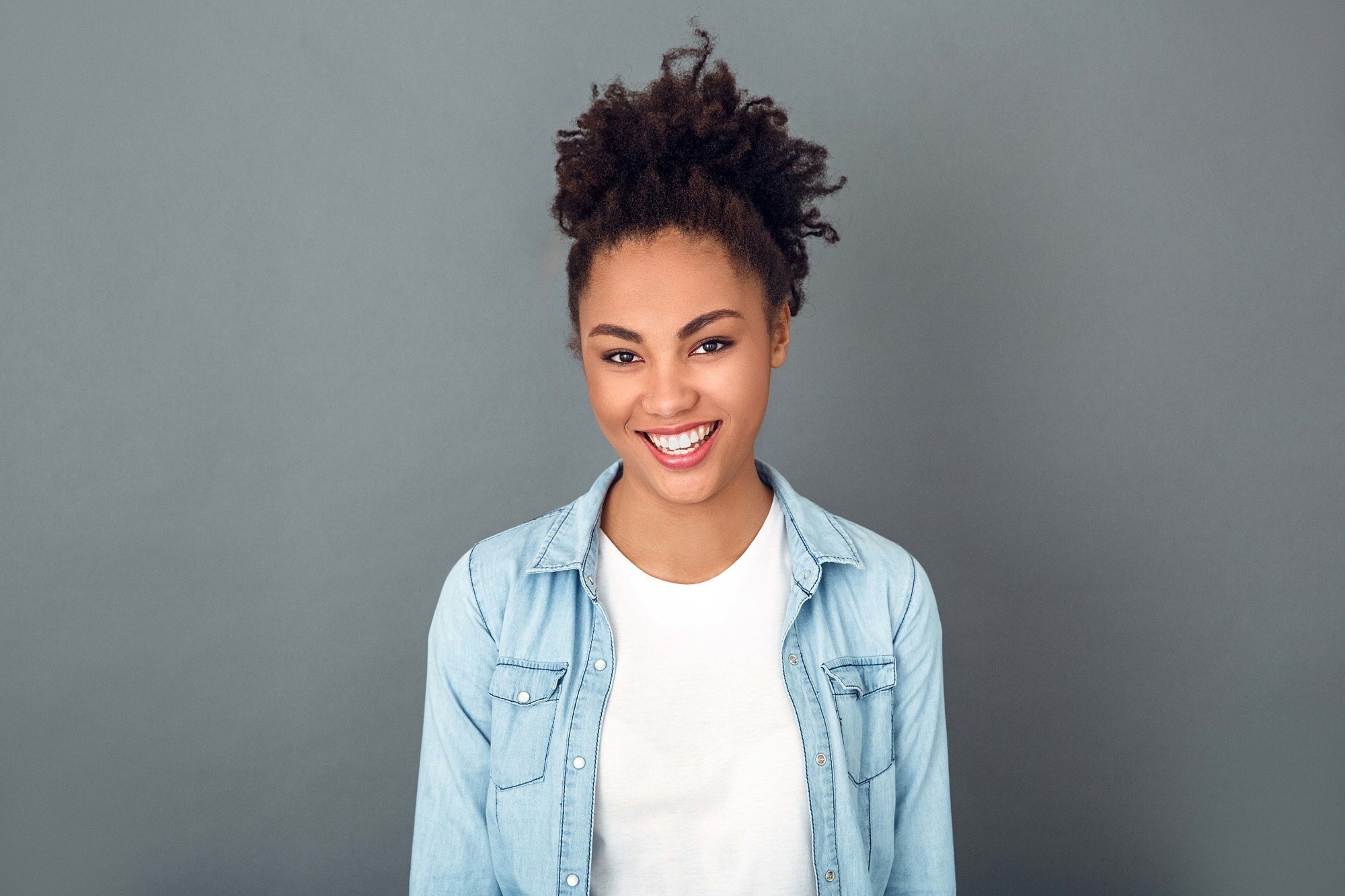 woman with a high puff ponytail