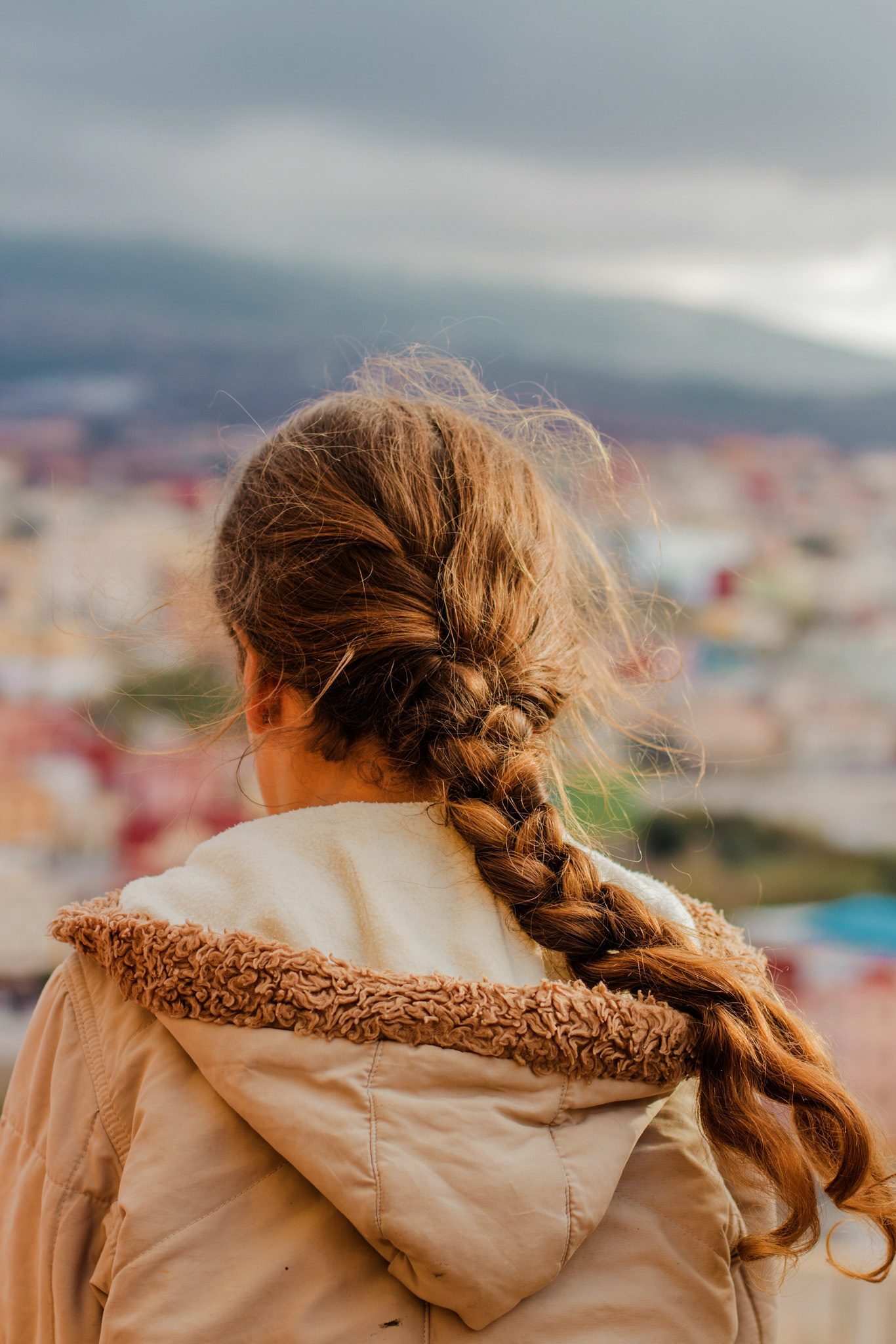 woman with long brown hair regular plait