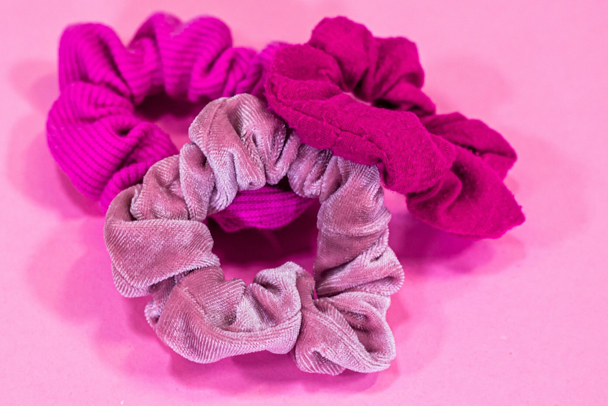 hair accessories: Three Pink Scrunchies on a Pink Background