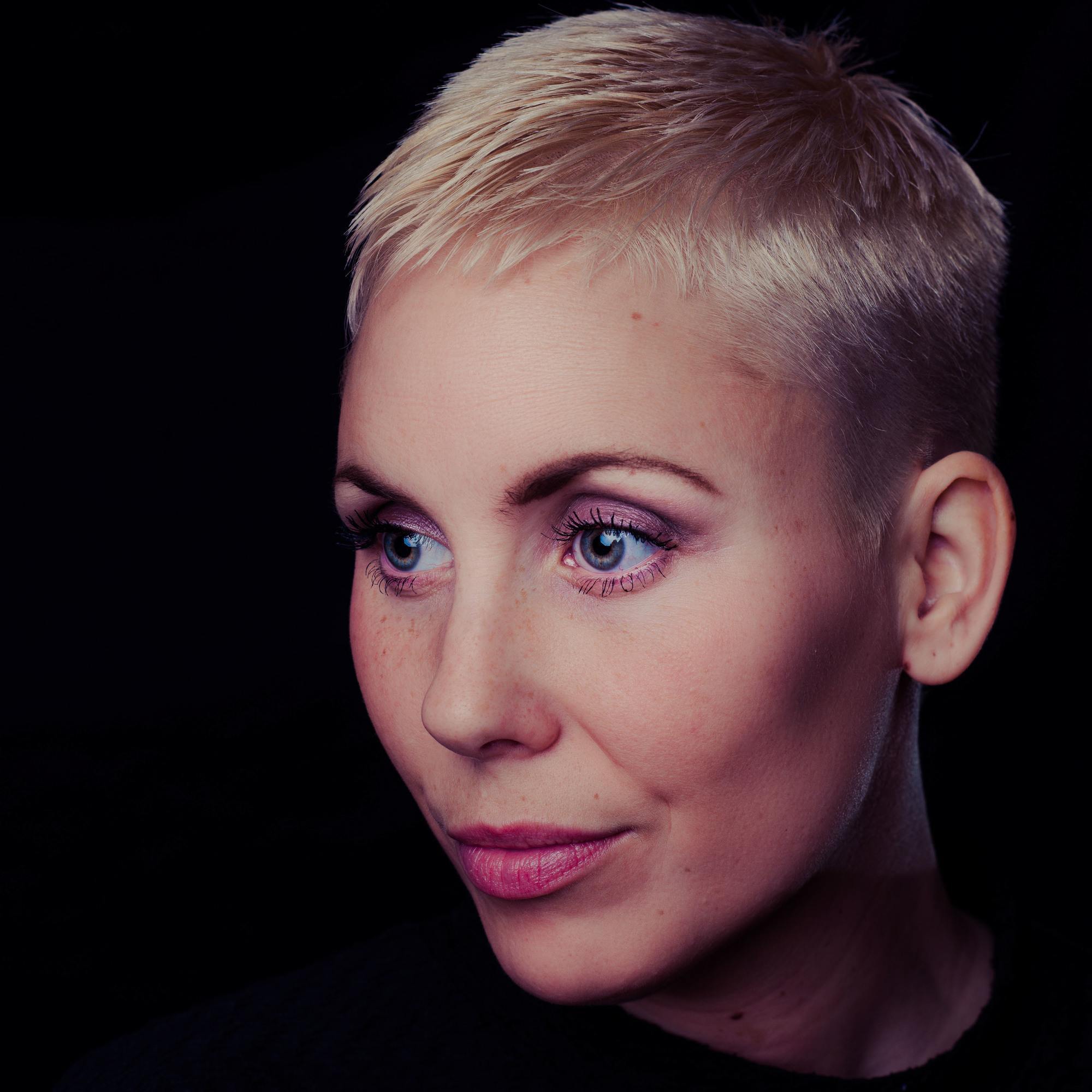 crops for women: woman with a blonde fade haircut