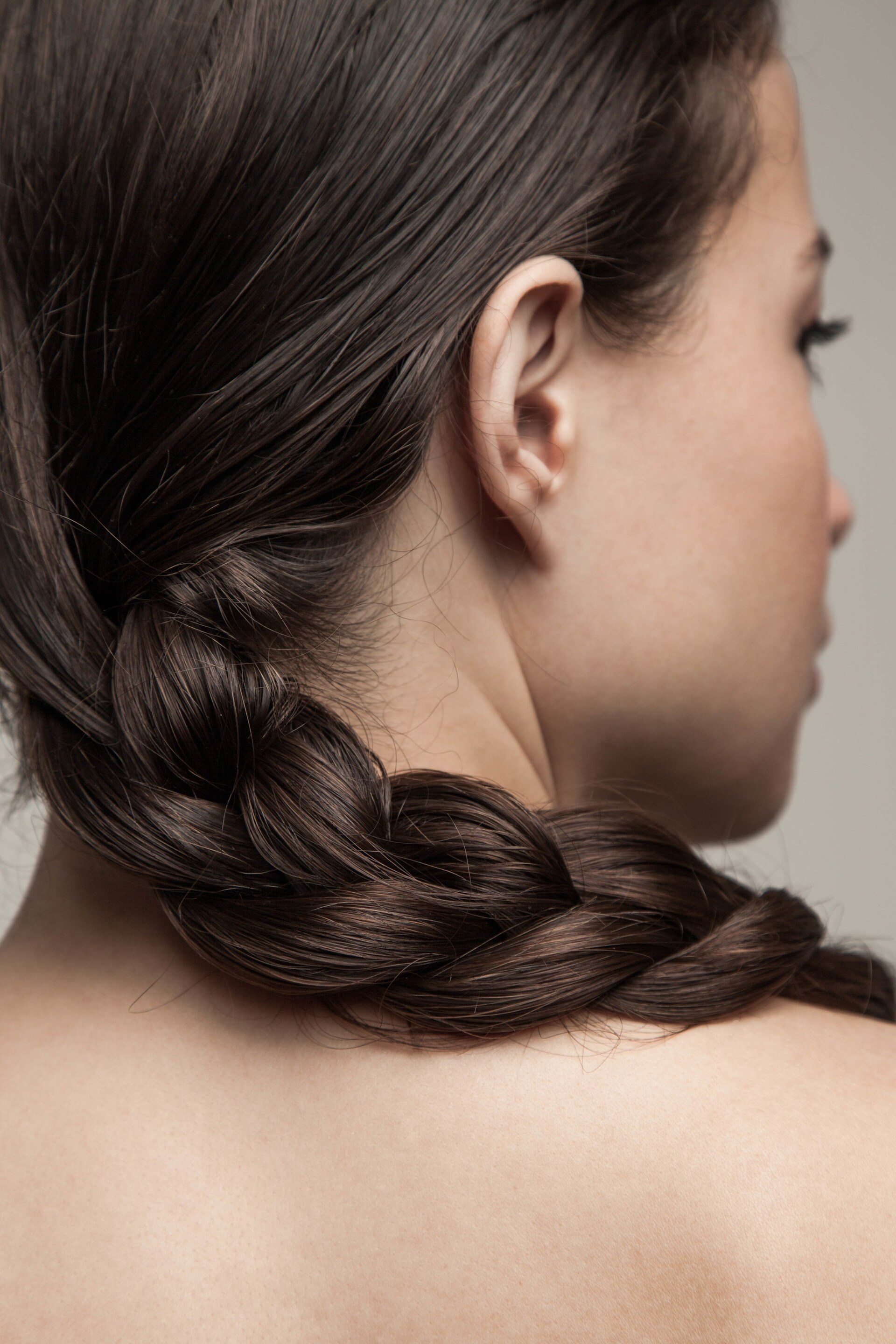 load shedding hairstyles: woman with a classic braid