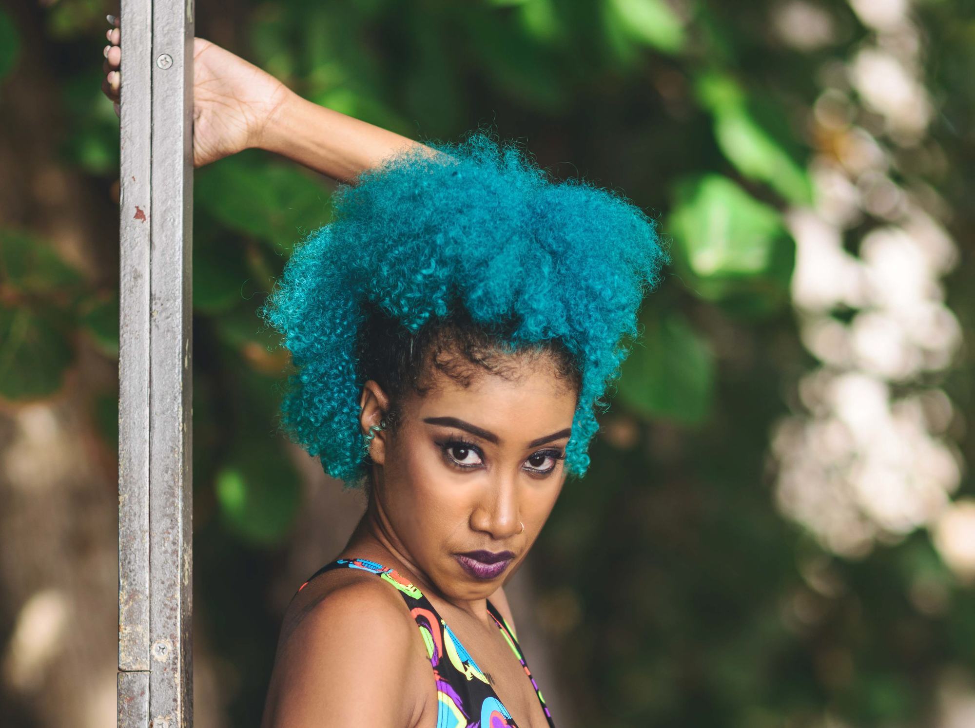 woman with bright blue afro hairstyle