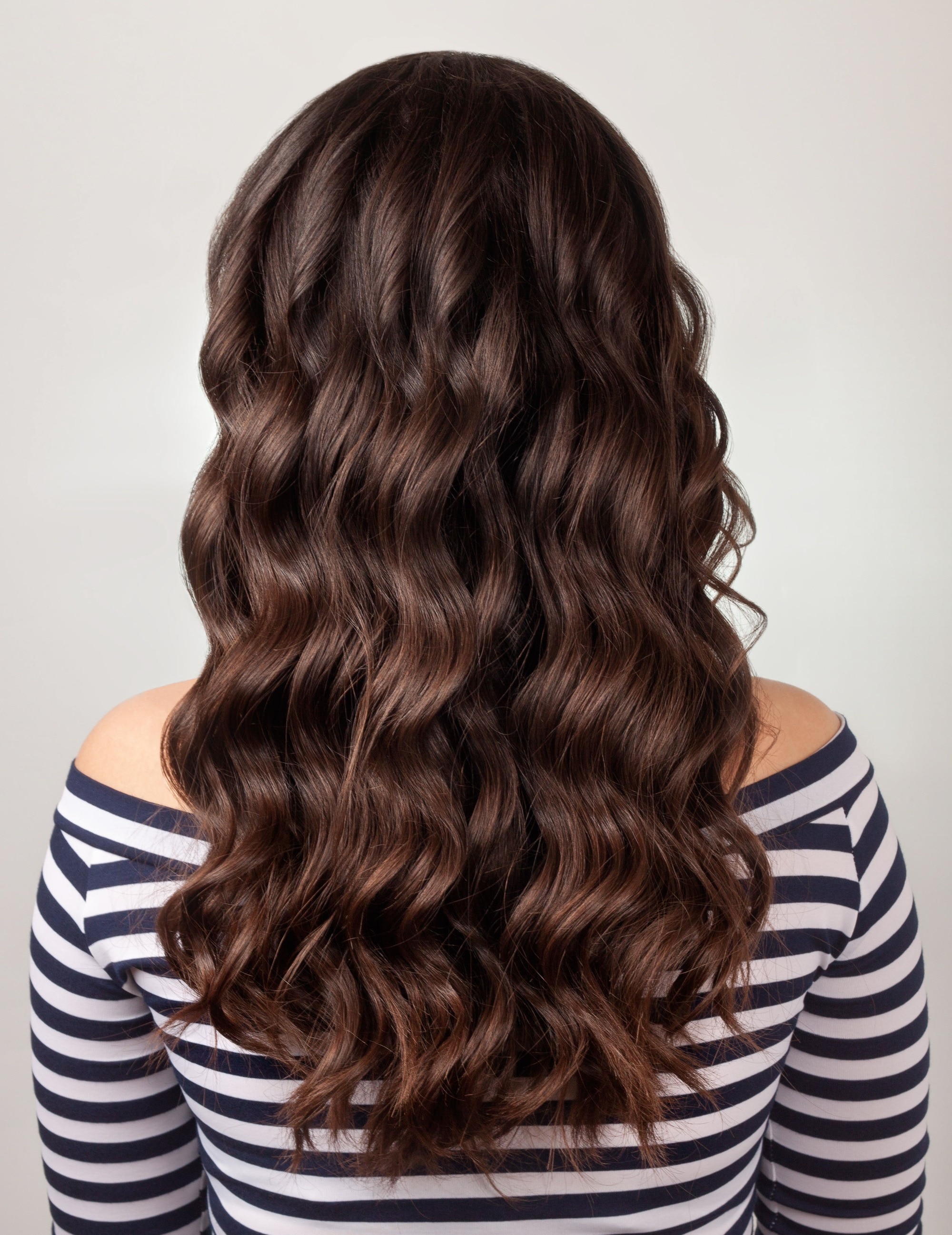 long brown hair with heat-styled waves