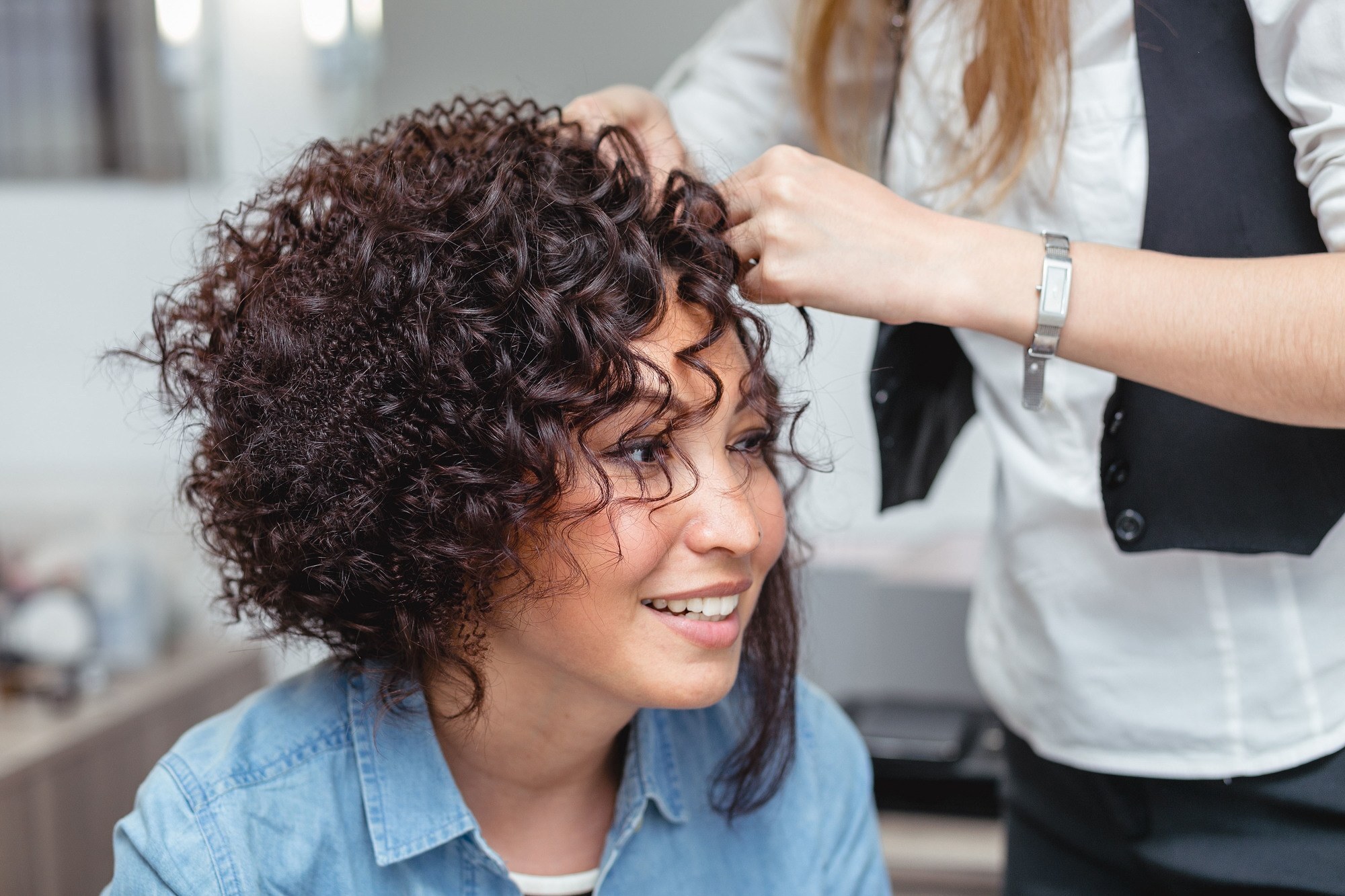 curling iron: woman with ringlet curls