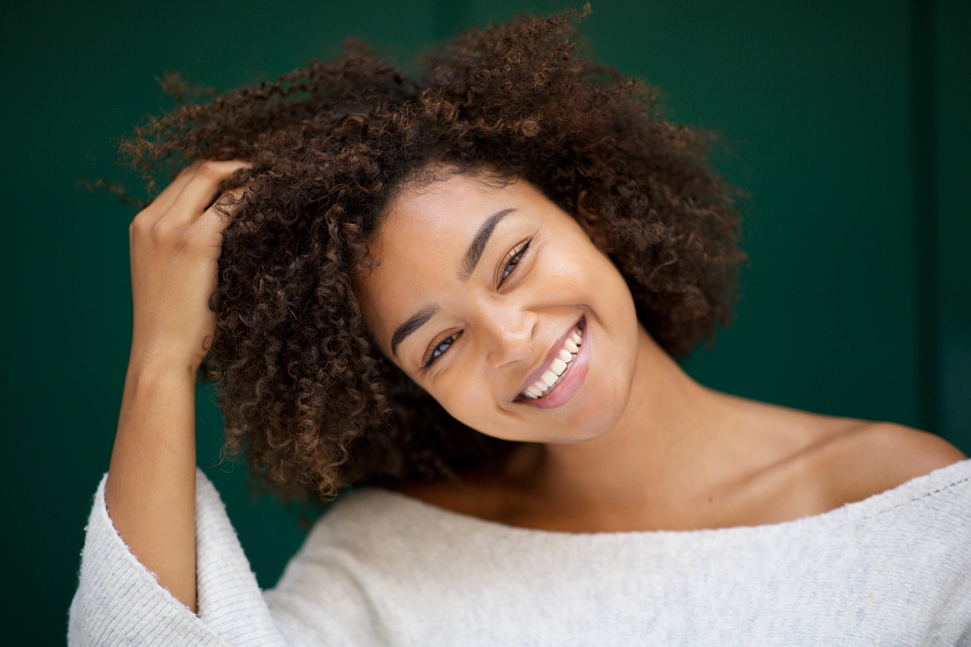 deep condition your hair: woman with brown afro hair