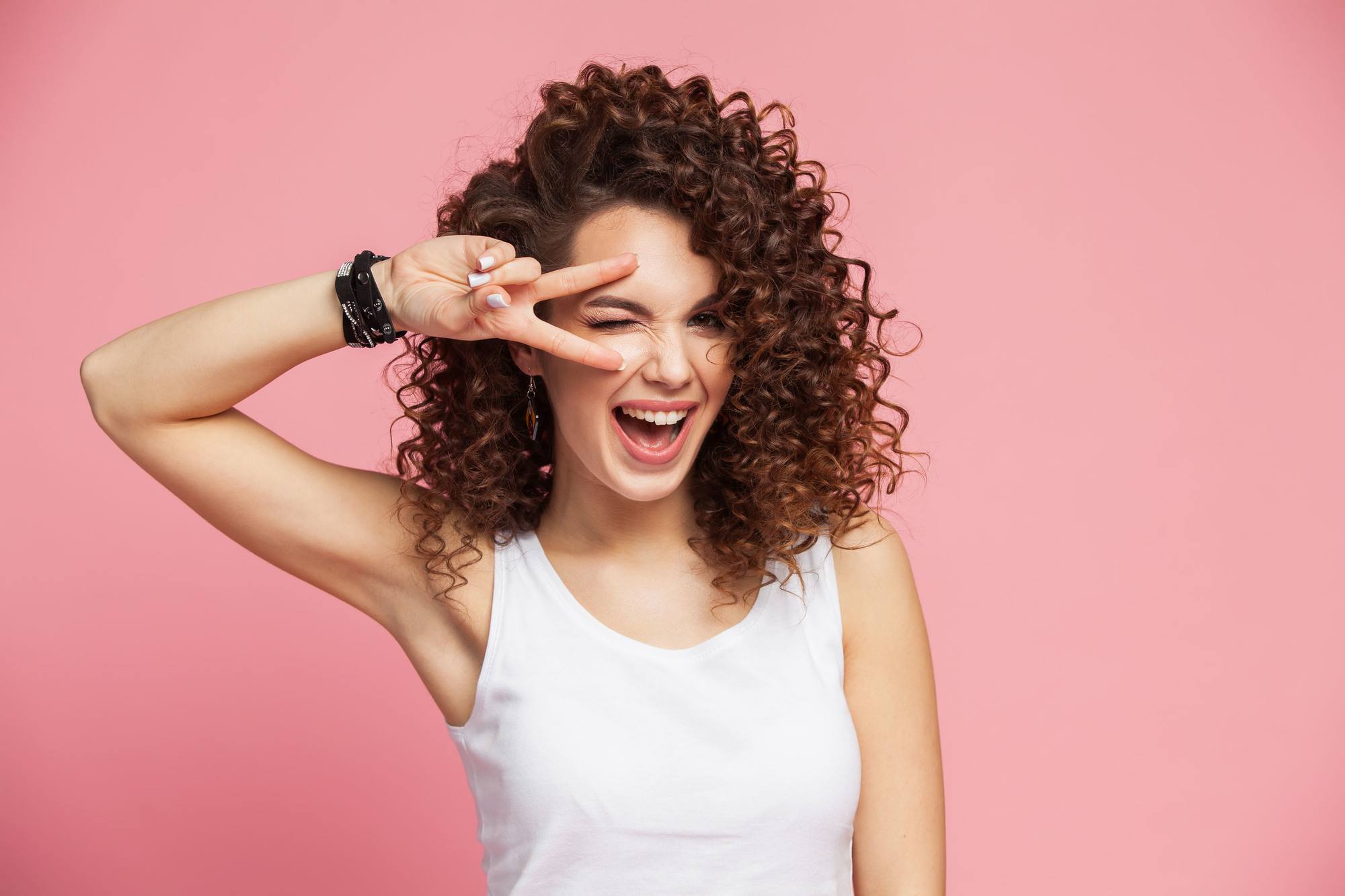 curl medium length hair: woman with shoulder length curly hair