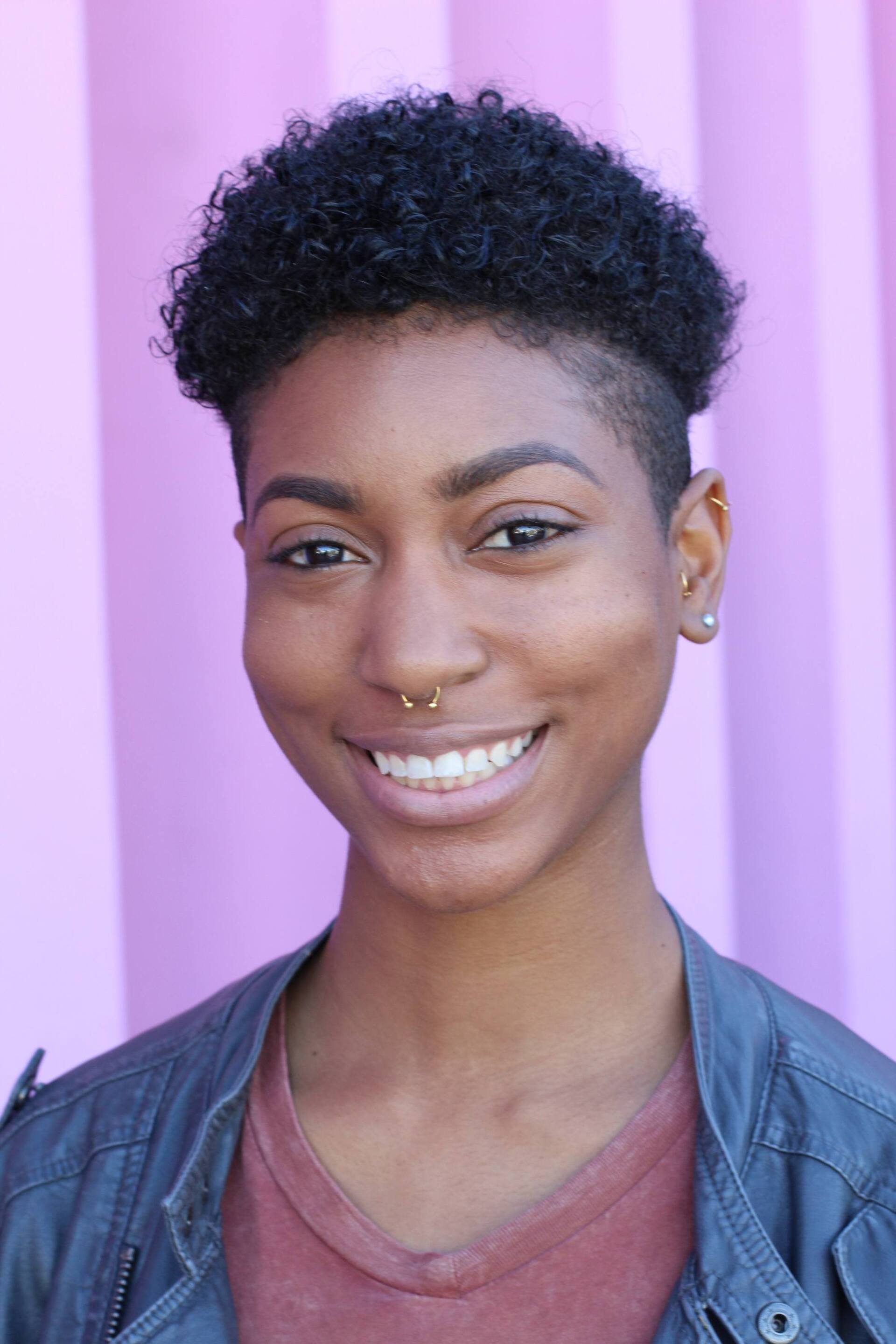 permed haircare: woman with an undercut and short curly hair