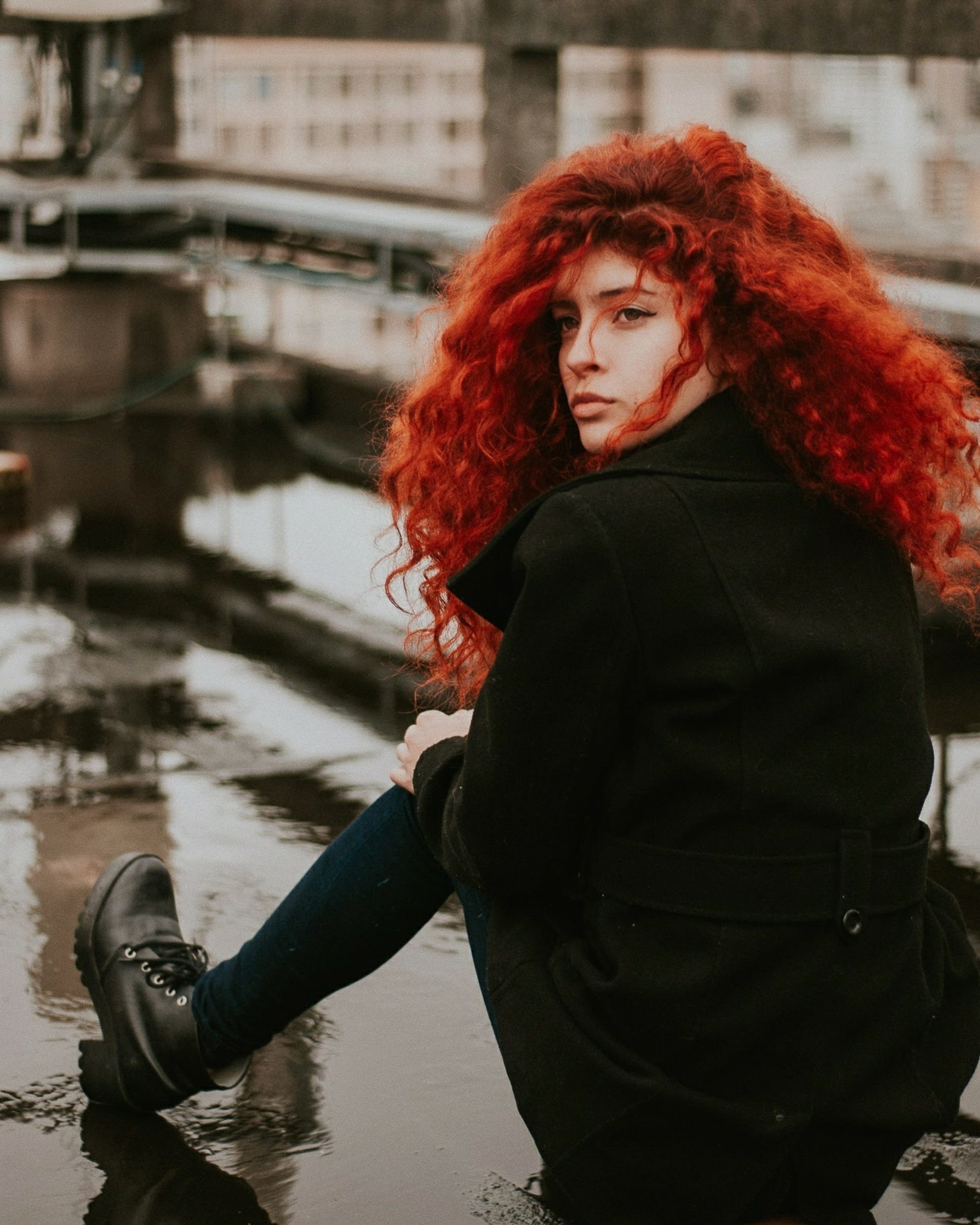woman with a curly long red hair