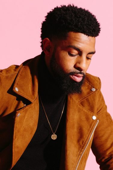 man with natural hair and a thick, full beard
