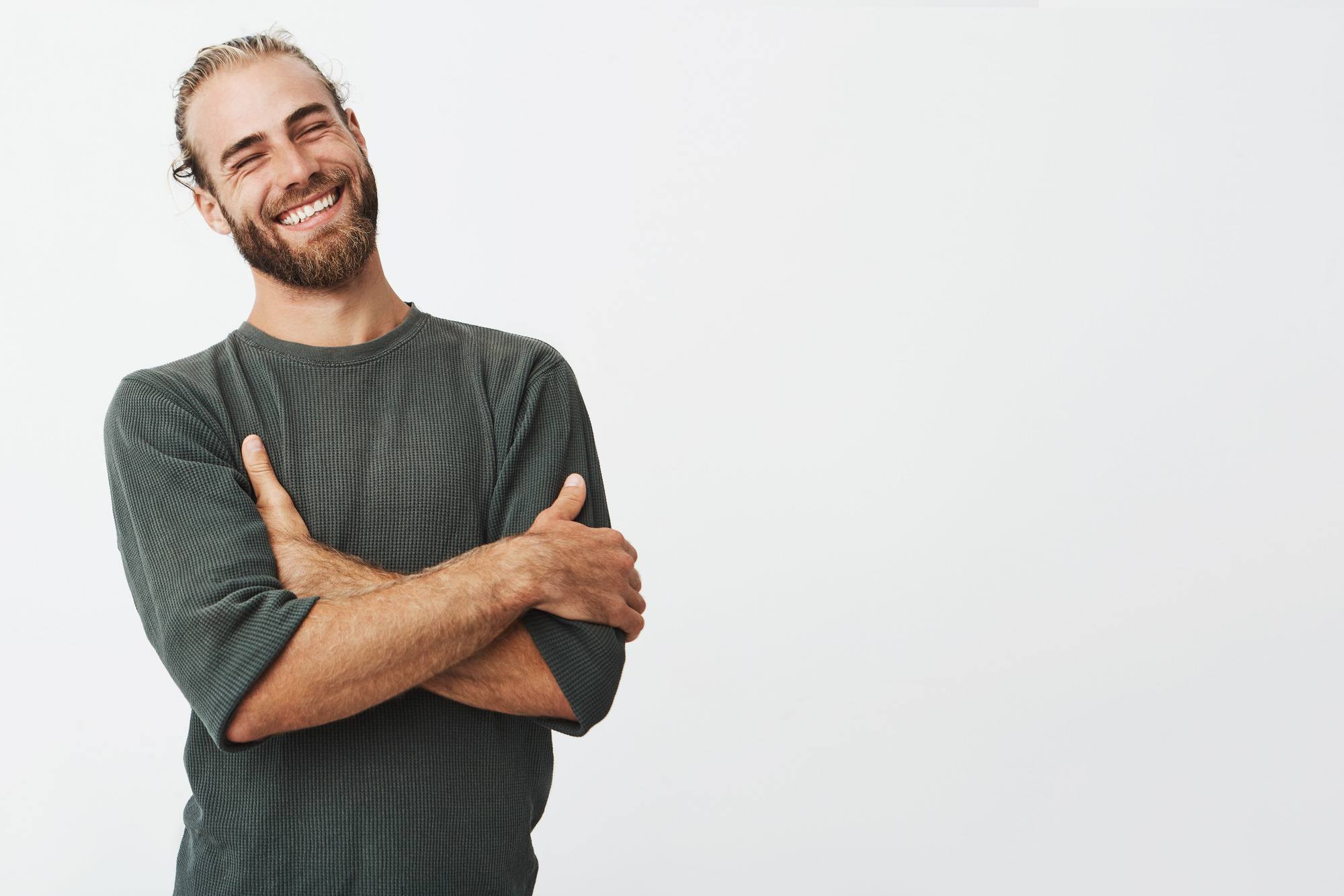 man with dirty blonde hair tied back and a full beard and moustache