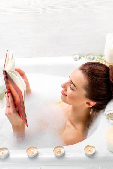 woman relaxing the bath hair in a bun