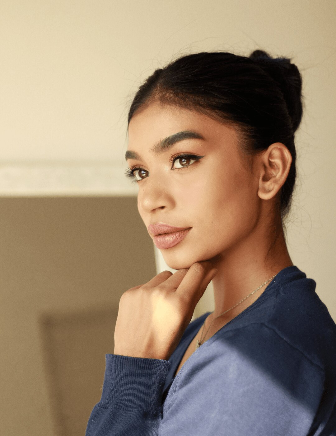 woman with second day hair sleek bun hairstyle