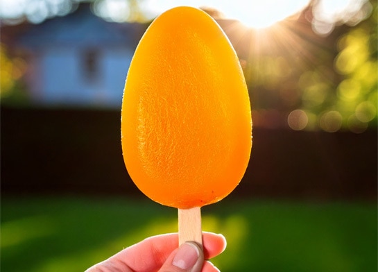 Easter egg-shaped orange Popsicle.