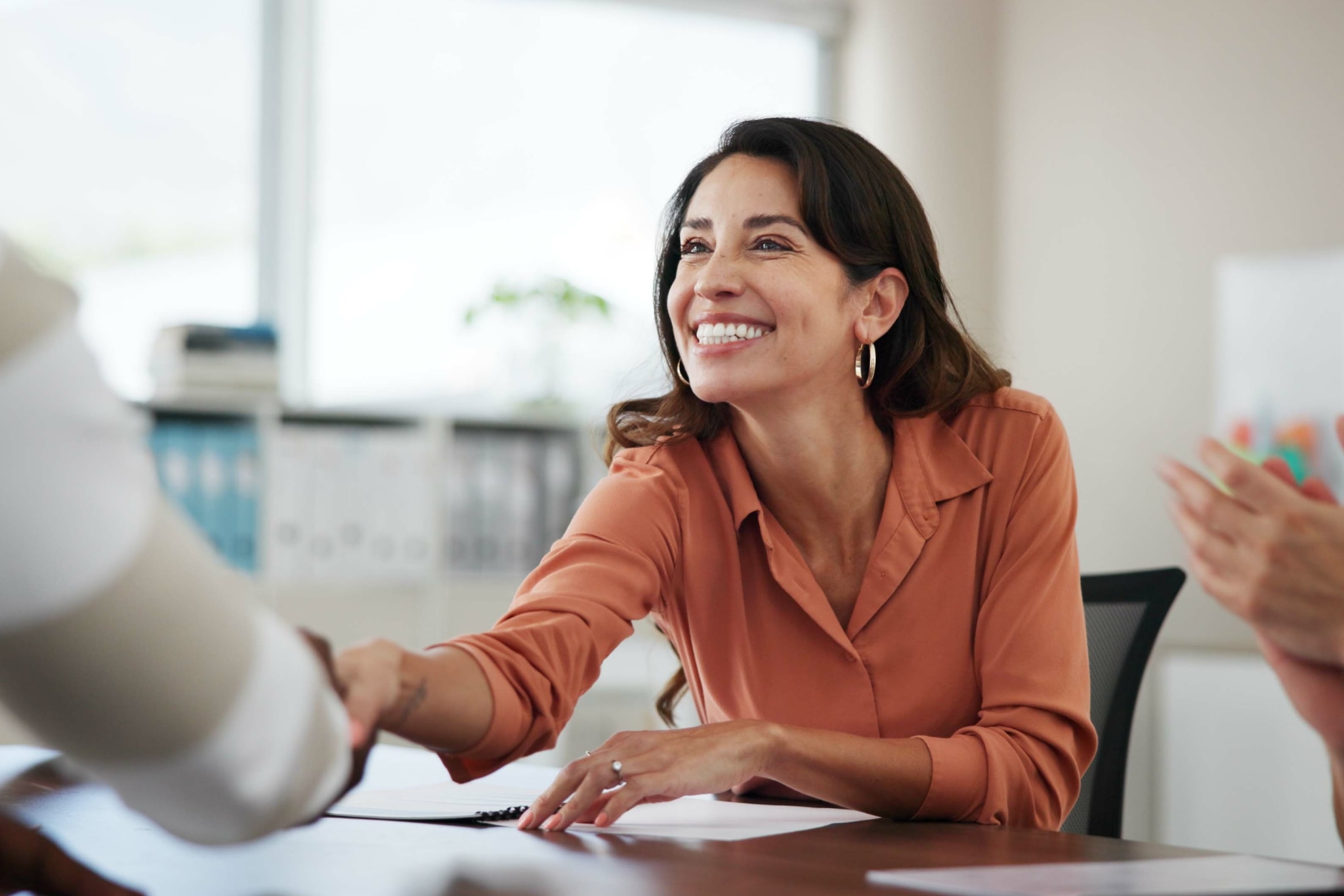 Confident woman in a boardroom with no sign of excessive sweating
