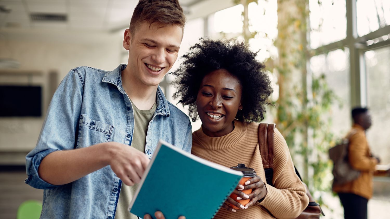 Happy college friends studying with no sign of sudden change in body odor