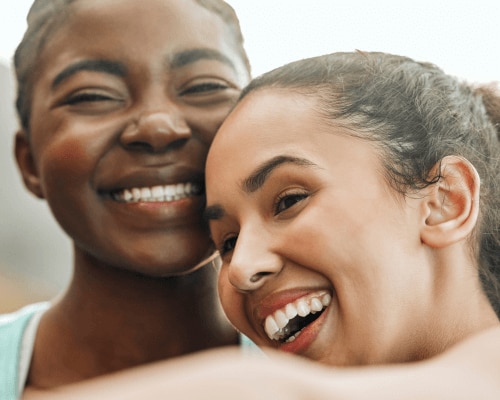Two happy women feeling confident about their deodorant ingredients