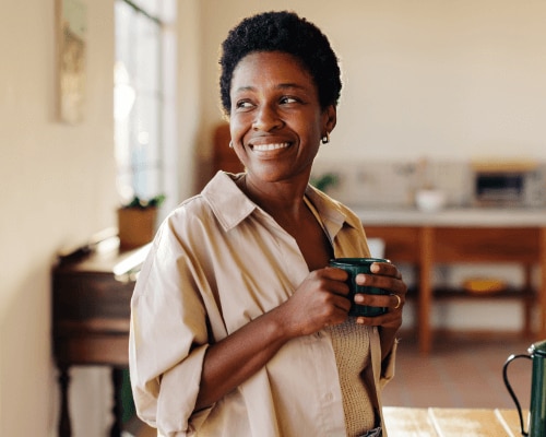 Woman enjoying a coffee at home
