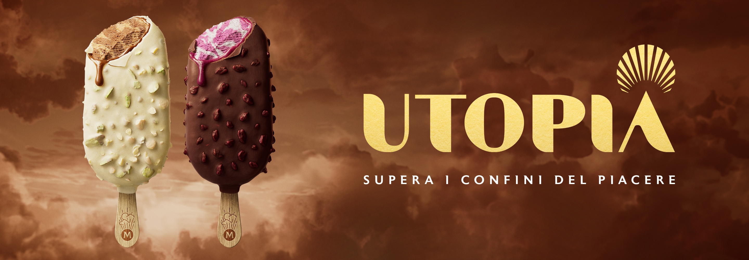 Due nuovi Magnum Double Hazelnut & Magnum Double Cherry stecchi di gelato marmorizzato ricoperti di croccante cioccolato, con inclusioni di nocciole e pezzetti di zucchero. Ad entrambi è stato dato un morso, rivelando un incredibile gelato marmorizzato e una salsa aromatizzata che gocciola da ciascuno di essi. Sono sovrapposti su uno sfondo marrone nuvoloso e onirico, con un logo dorato "Utopia" e il testo "Take your pleasure beyond".