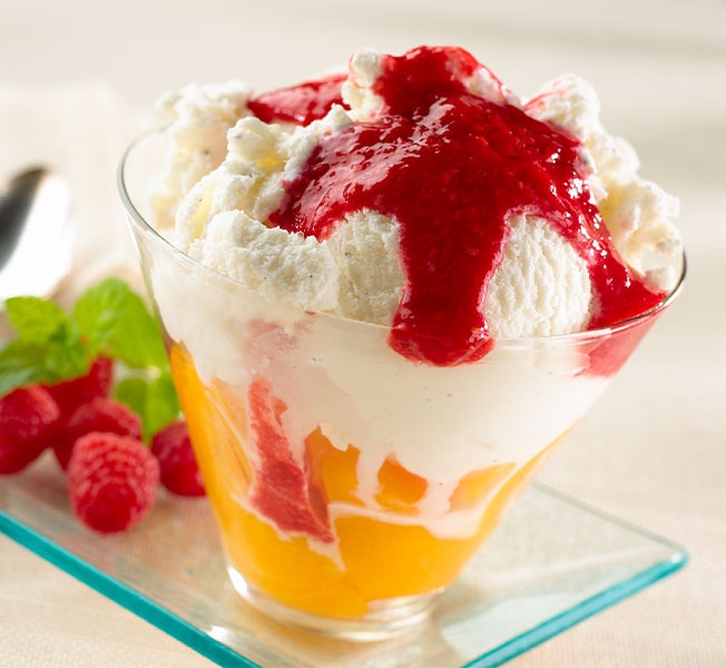 Close-up of a peach melba cup.