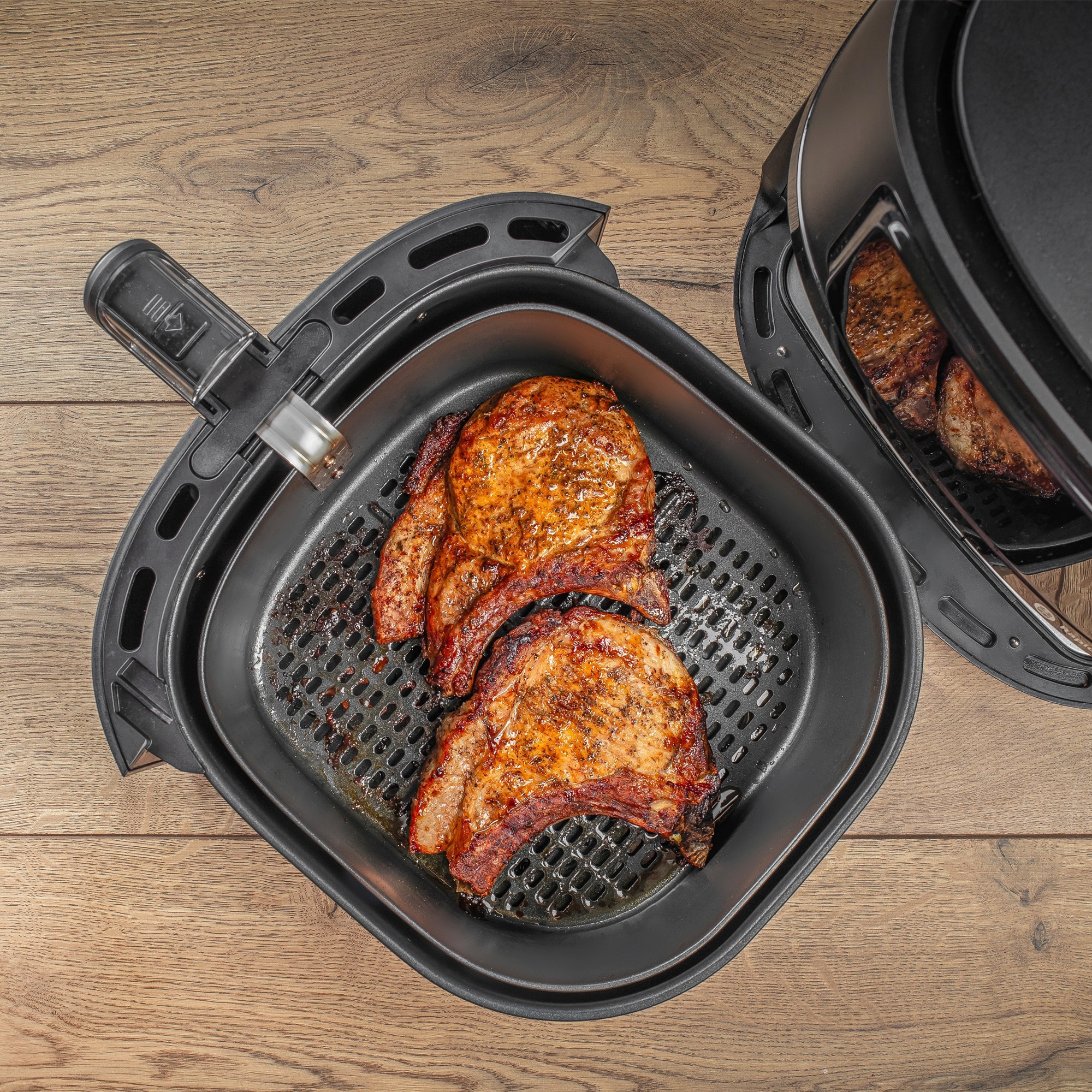 Two pieces of meat in an air fryer