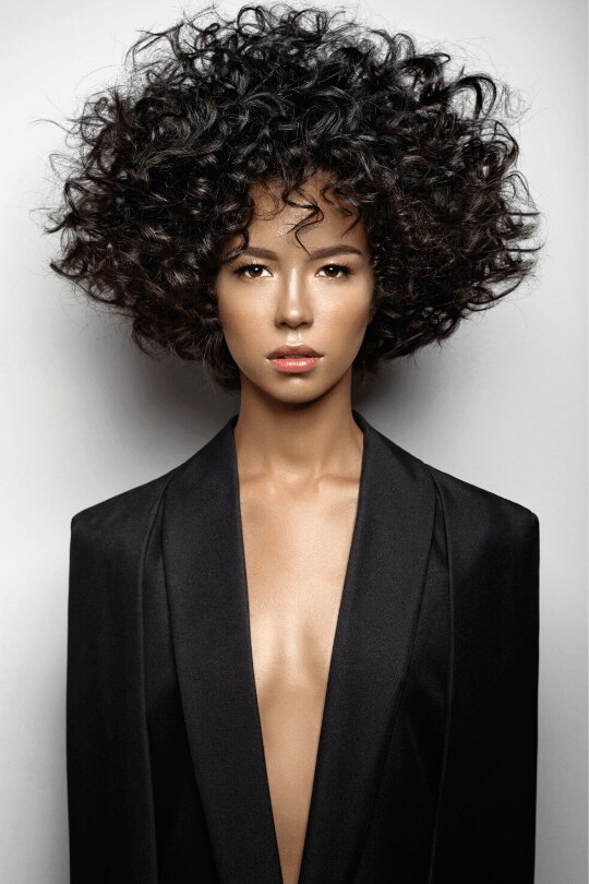 woman with large tapered afro natural curly hair sunmet hairstyle